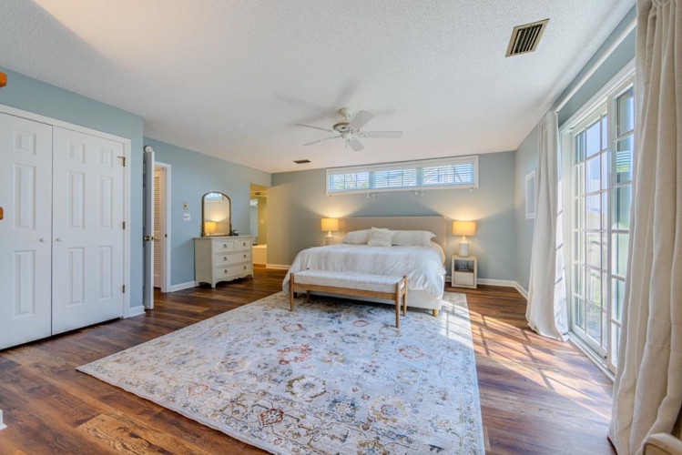 Sink into the plush comfort of your serene bedroom suite, where soft blue tones and warm natural light create the perfect retreat for restful nights.