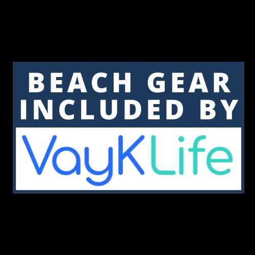 Arrival signage for VayKLife indicating complimentary beach gear is provided during your stay.