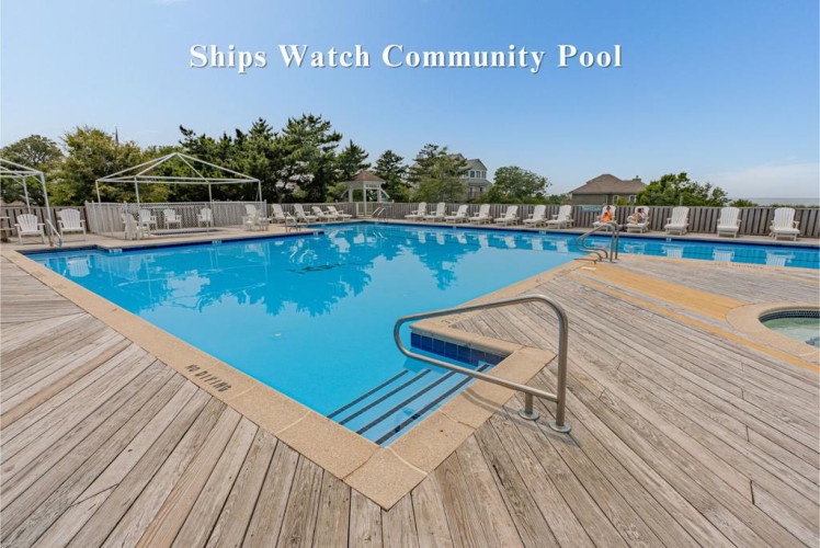 Dive into this sparkling community pool, where sun-soaked days await. Lounge on the deck, cool off in the blue water, and enjoy carefree vacation moments under bright skies.