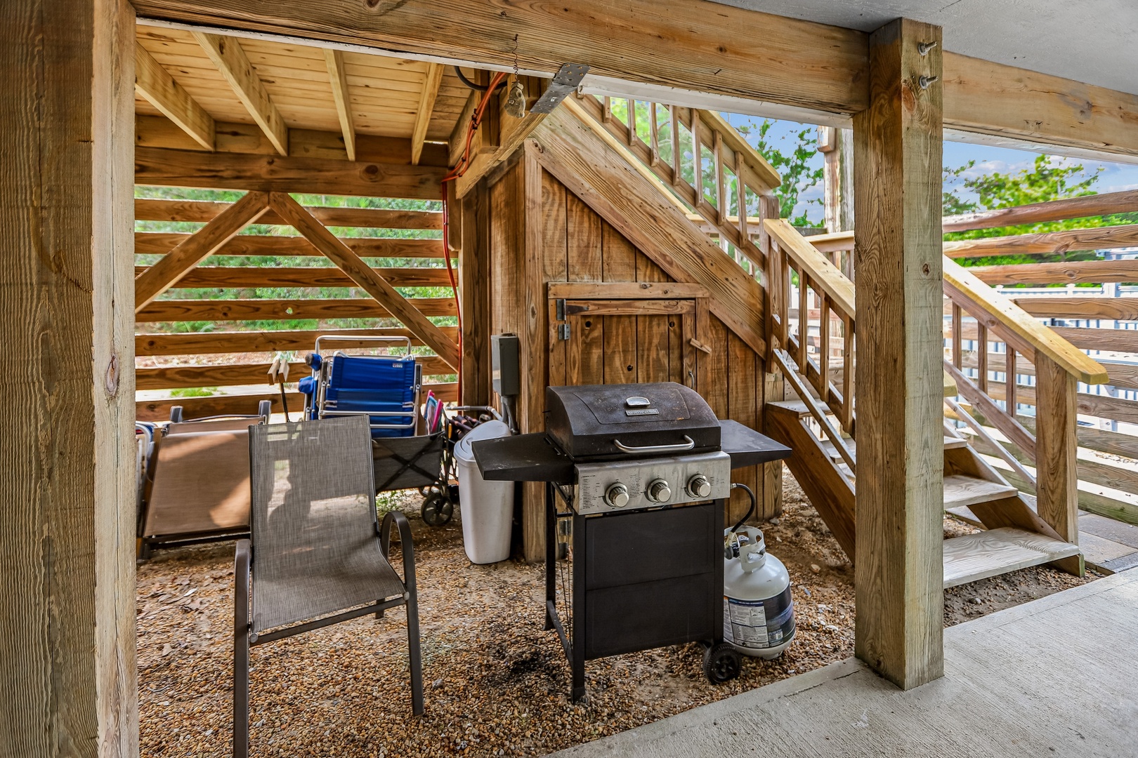 Fire up the grill and enjoy a cookout under your own covered outdoor kitchen, complete with seating and rustic charm.