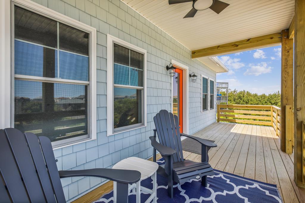 Kick back on your private covered deck with coastal breezes and distant dune views—perfect for morning coffee or sunset watching in total comfort.