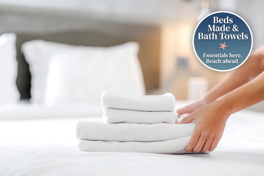 Your fresh, plush towels are laid out with care, ready for your arrival. Settle into the comfort of crisp linens and beach-ready amenities.