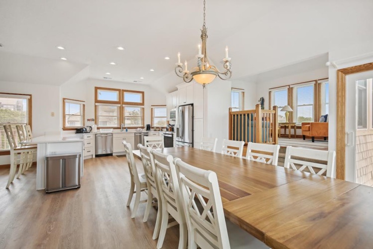 Picture yourself here—bright, open spaces where natural light pours through elegant wood-framed windows, warming the gleaming hardwood floors beneath your feet as you gather with loved ones.