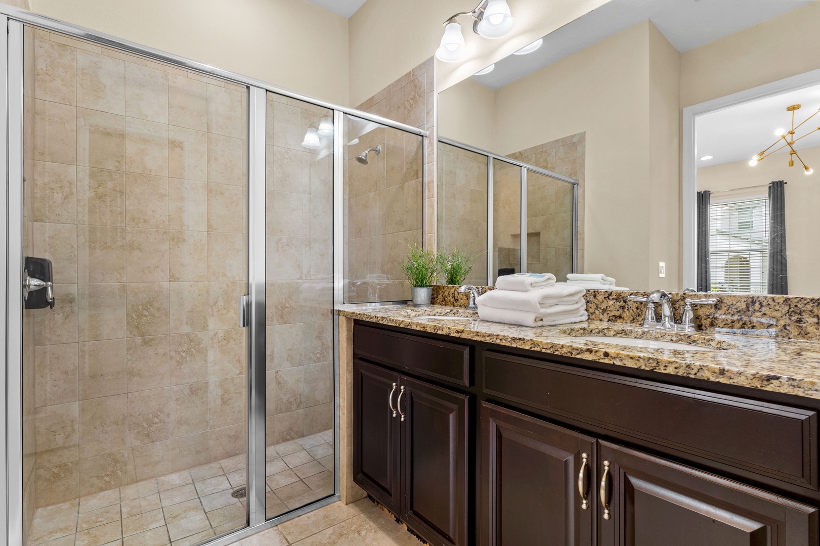 Shared ensuite bathroom with walk-in shower accessible from the common area
