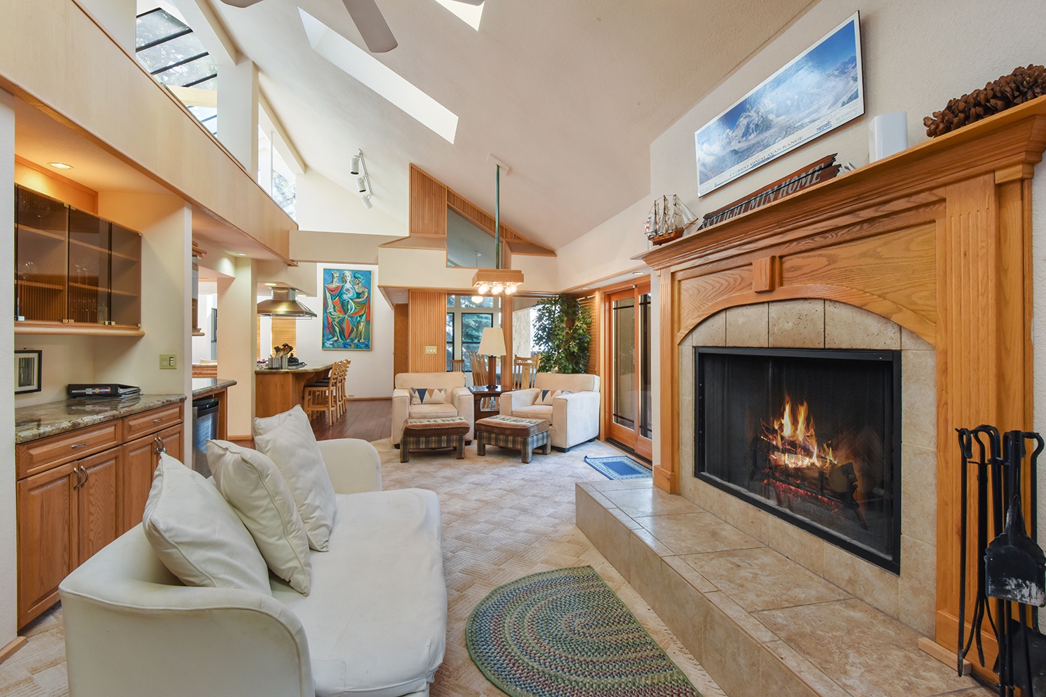Open living space level 2 with fireplace, Smart TV, and deck