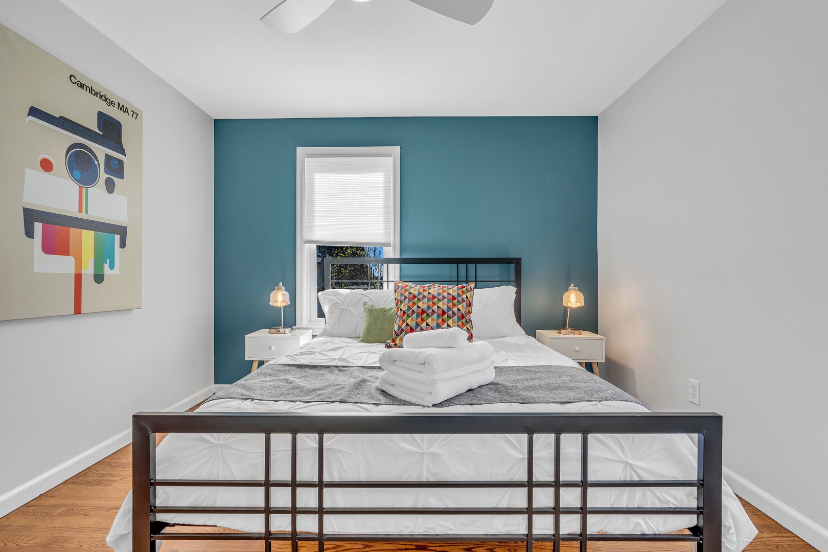 This serene 2nd floor bedroom showcases a plush queen-sized bed