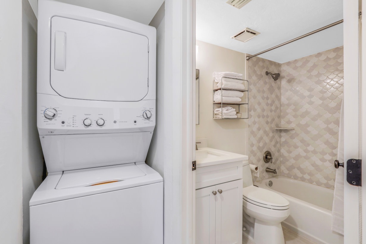 stackable washer & dryer out side of shared bathroom