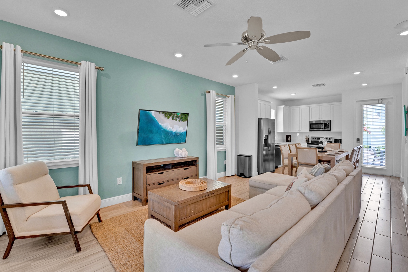 Relax in this bright and airy living space with modern amenities and coastal decor