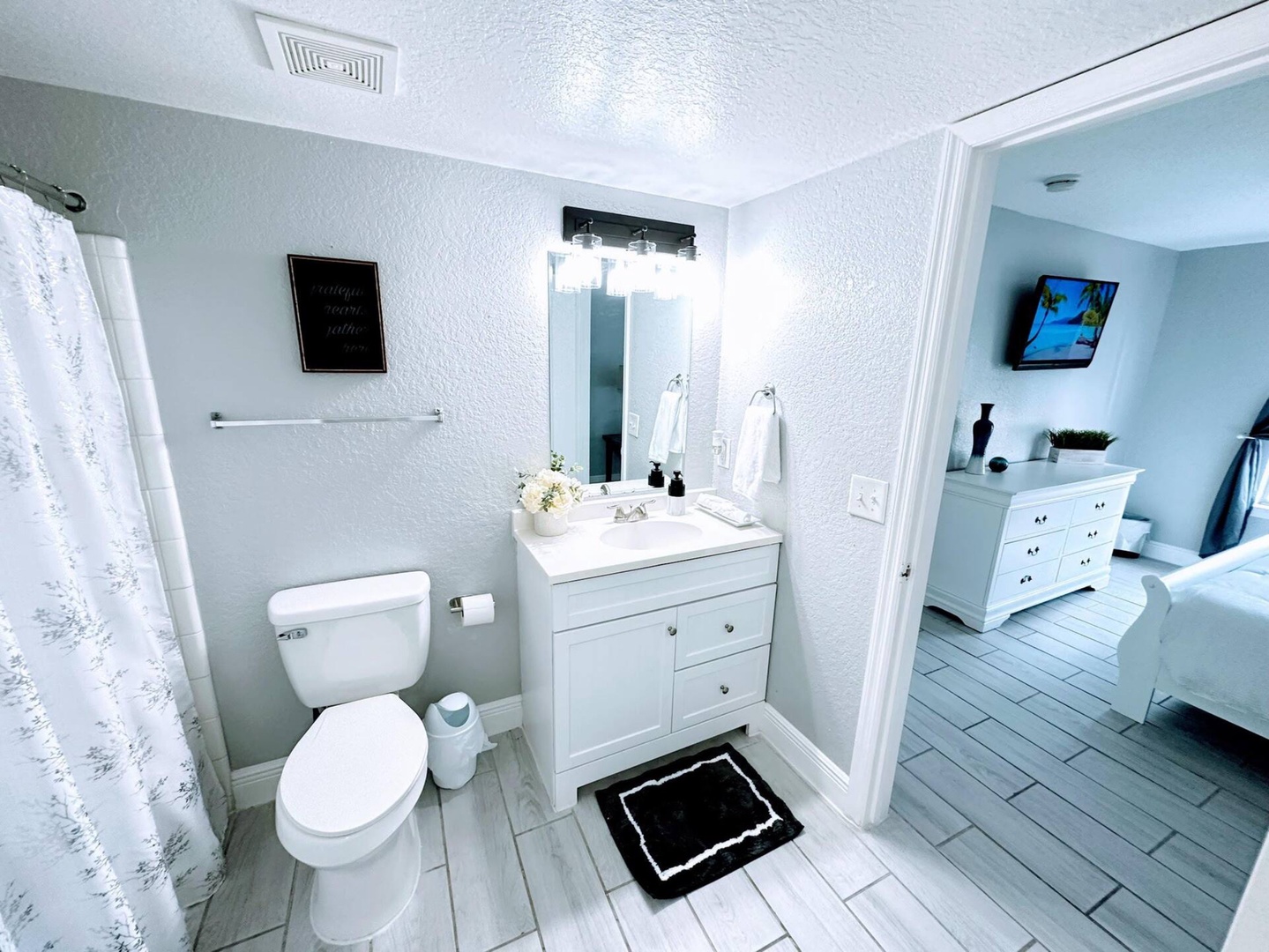 Wash up in this queen ensuite, with a single vanity with shower/tub combo