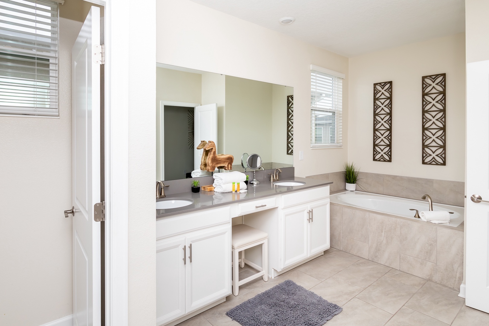 The final ensuite includes a double vanity, shower, & luxurious soaking tub