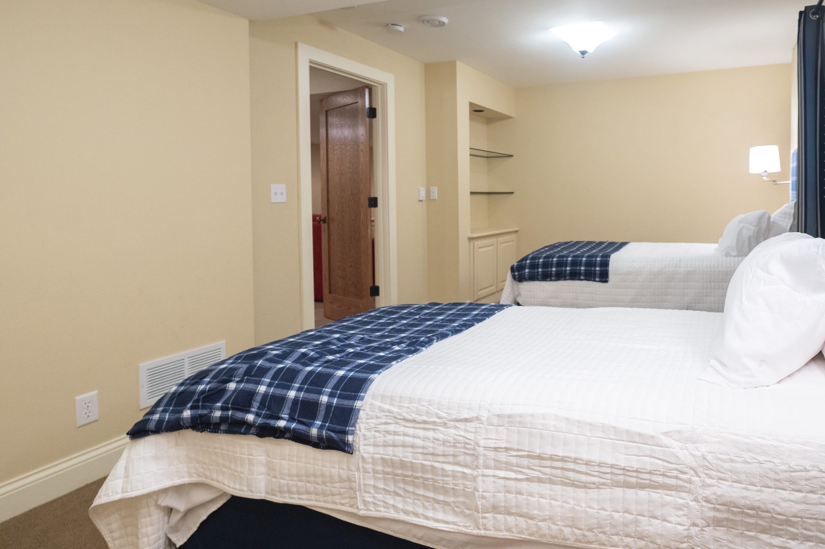 A pair of comfortable twin beds is available in the lower-level bedroom