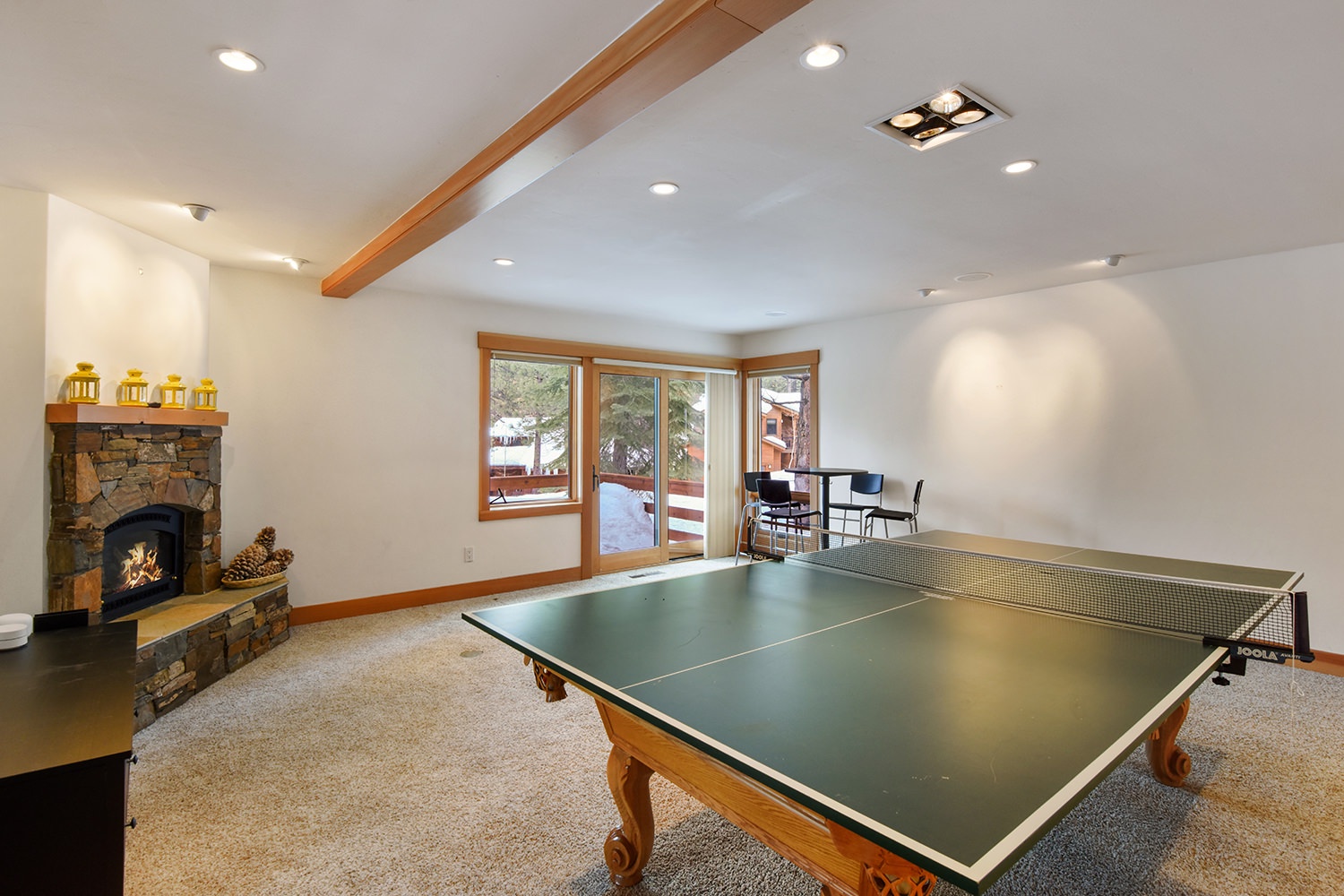 Game room with pool table, games, and fireplace (downstairs)