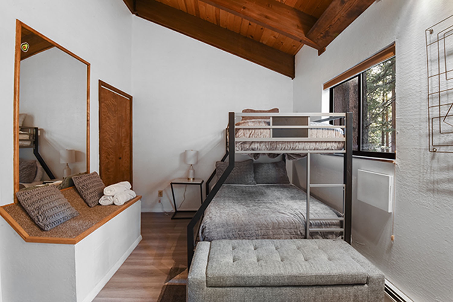 Unit #3: The 3rd floor back bedroom offers guests twin-over-full bunks & changing table