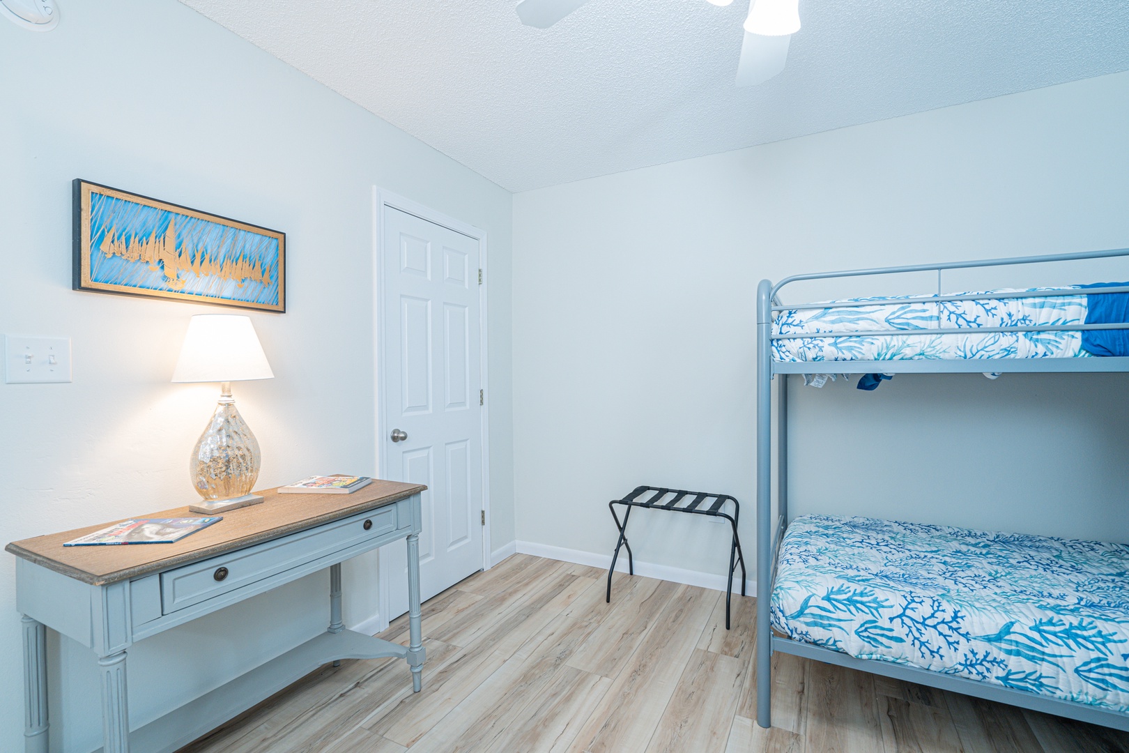 The final bedroom retreat offers a pair of cozy twin-over-twin bunkbeds