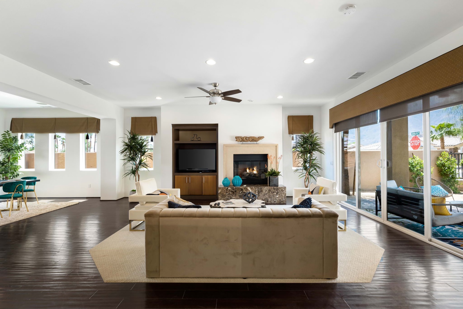 Living room is equipped with a SmartTV and access to backyard