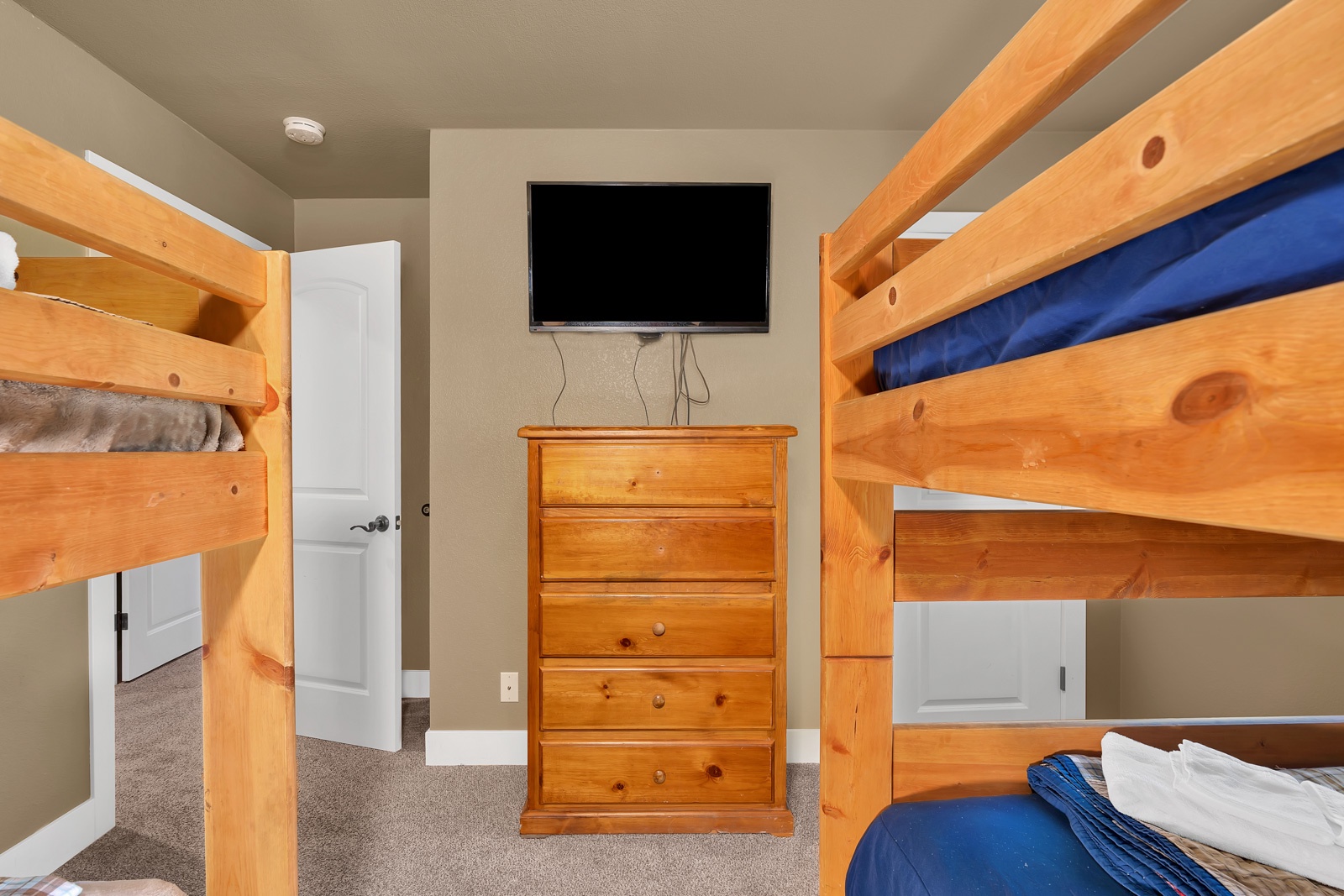 The 2nd  lower-level bedroom offers 2 twin-over-twin bunkbeds & a Smart TV