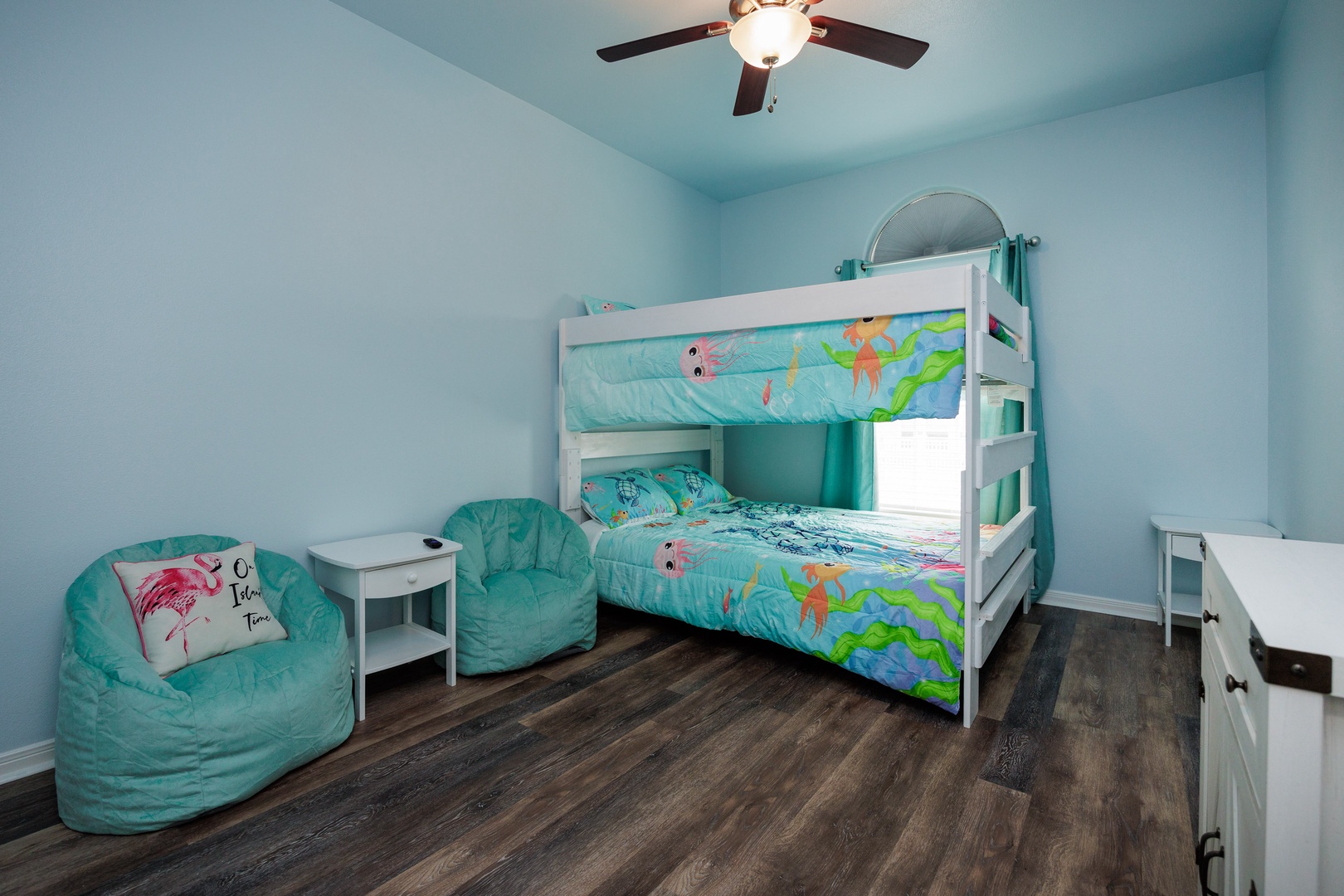 Bedroom 3 with queen/queen bunk bed, children's sitting area, and TV