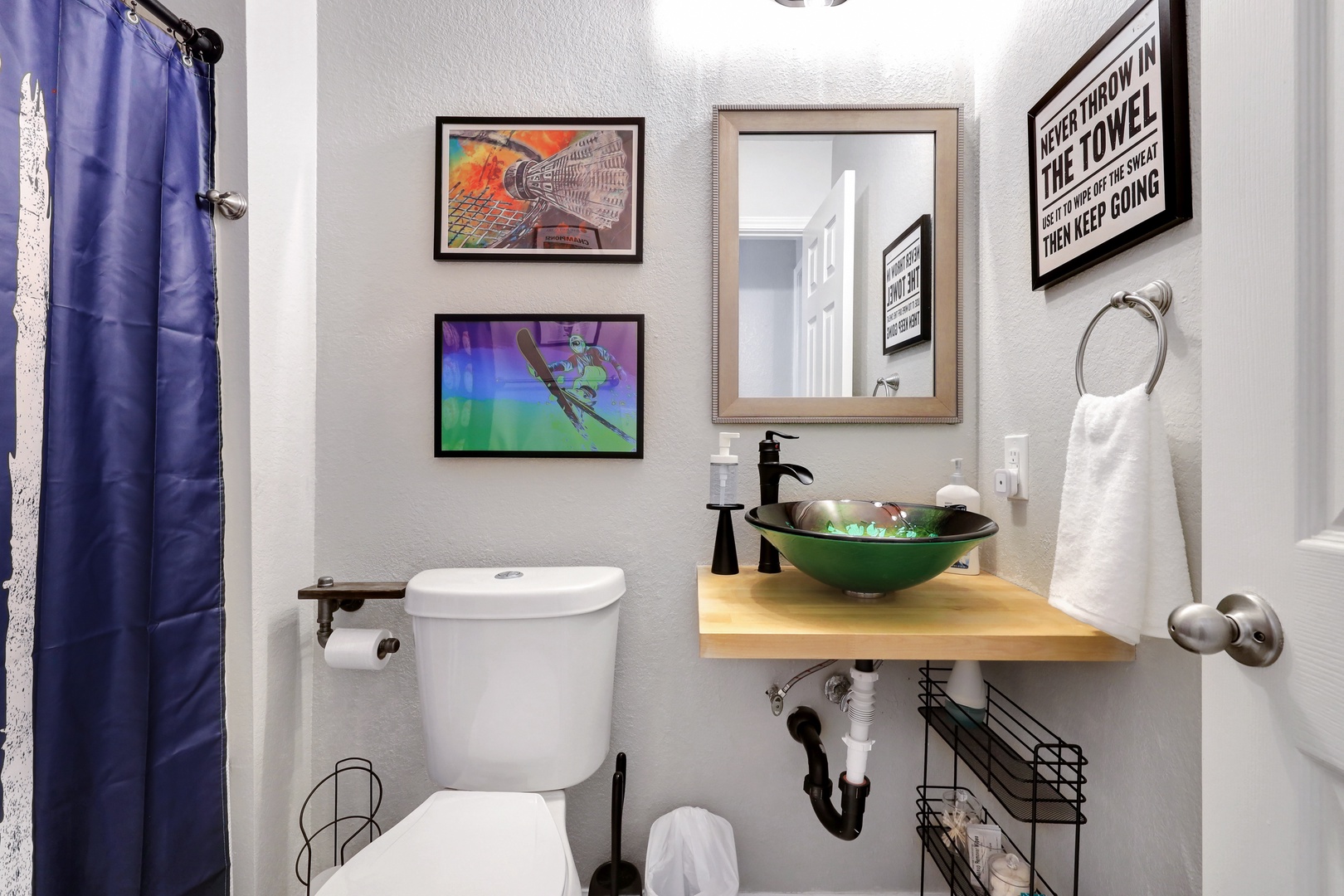 This first-floor full bath showcases a chic vanity & shower/tub combo