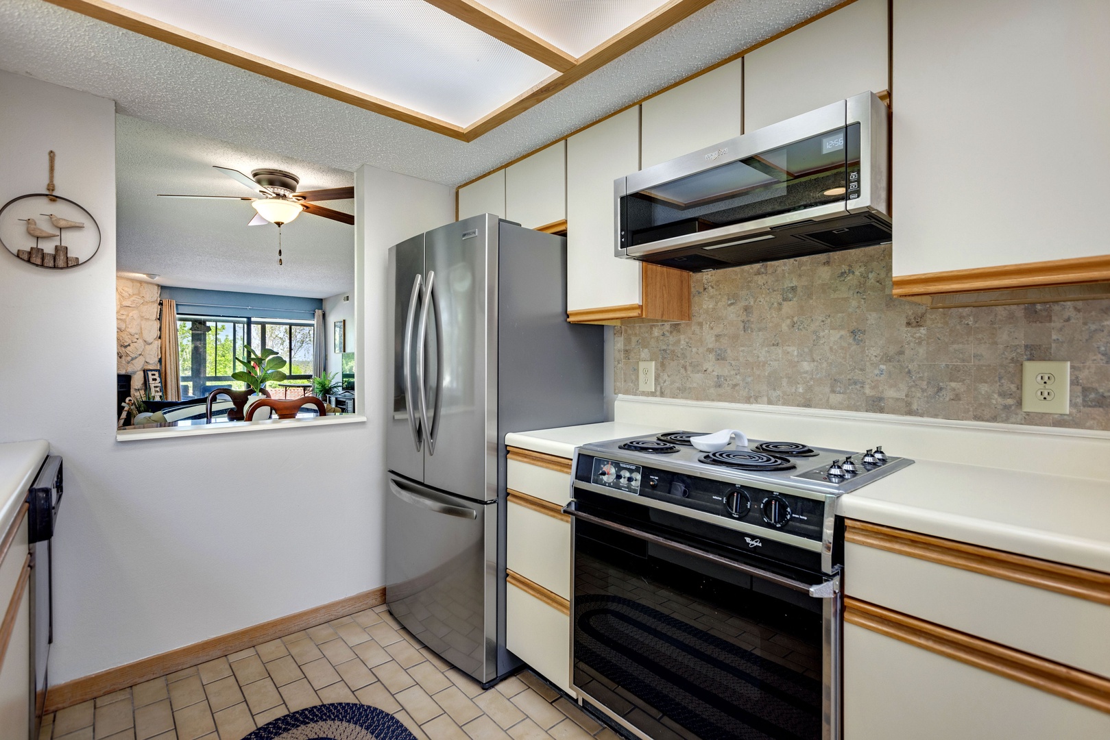 The quaint kitchen offers ample space and all the comforts of home