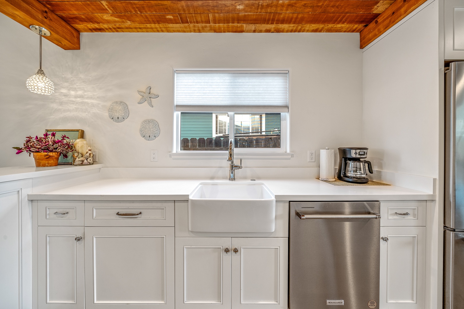 The gleaming coastal kitchen is spacious & offers all the comforts of home