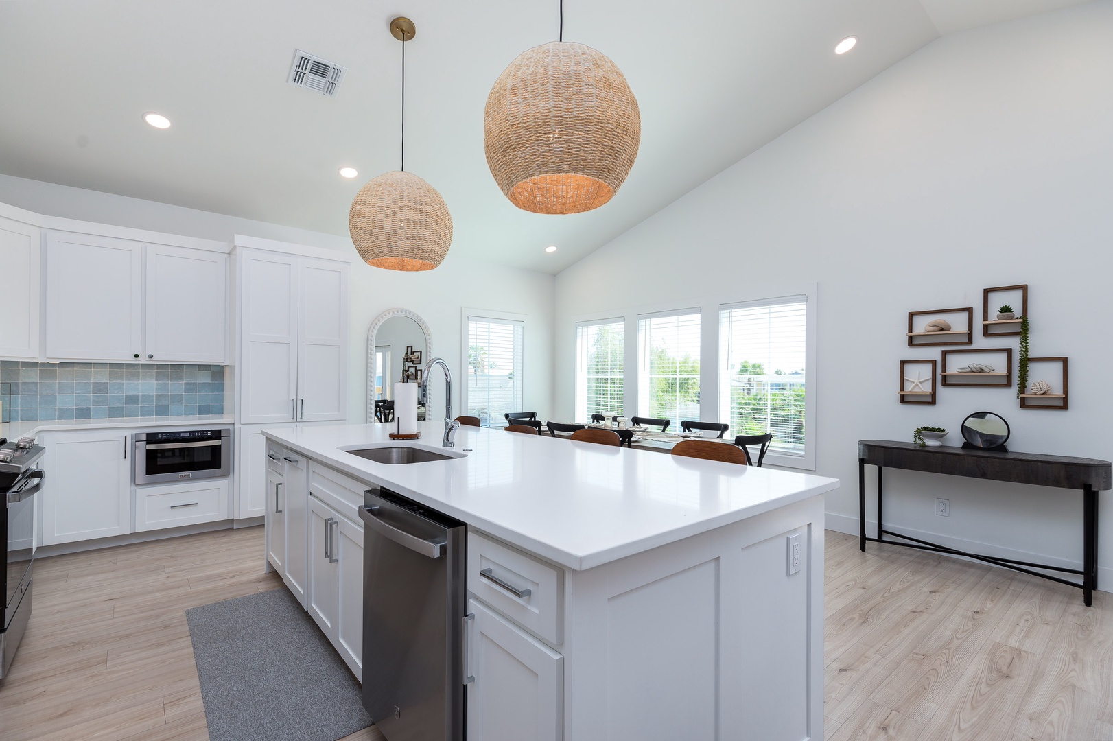 Step into the open coastal kitchen, offering all the comforts of home