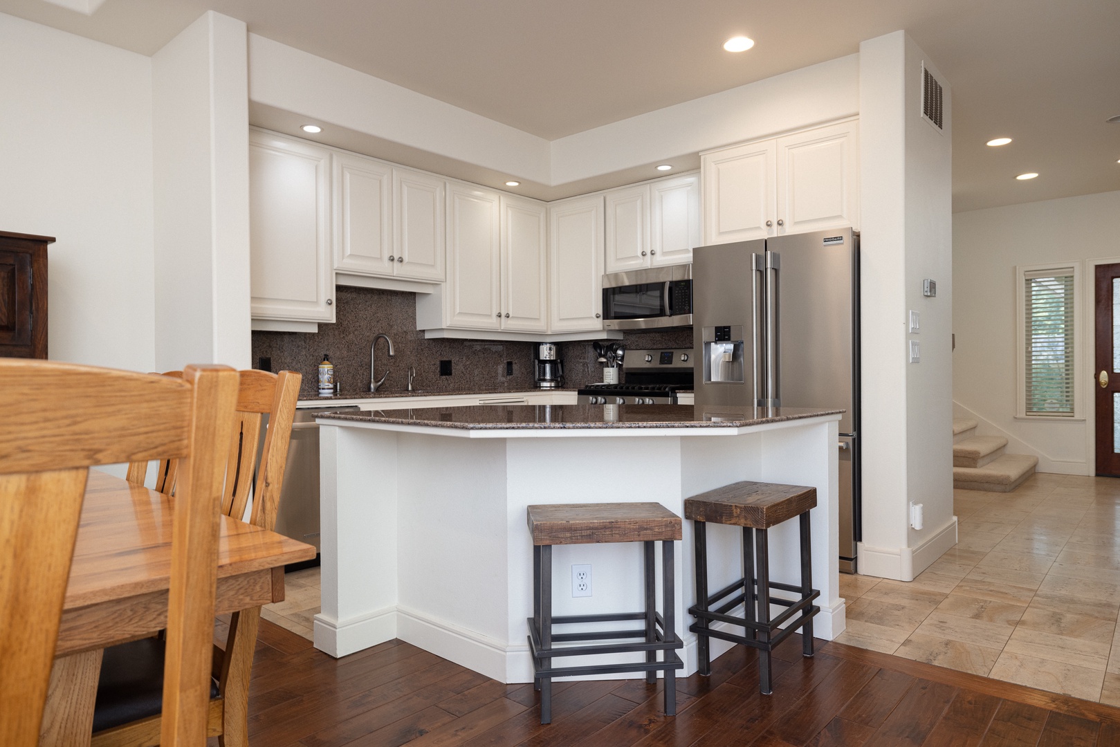 The open, airy kitchen offers ample space & all the comforts of home