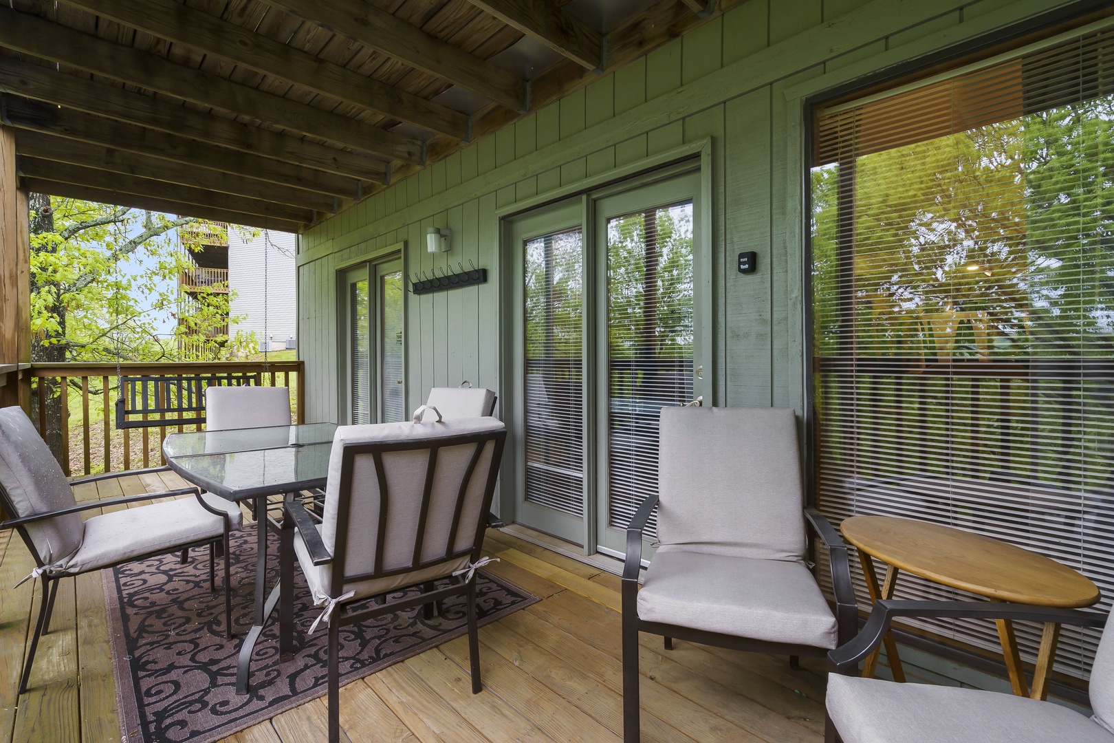 Panoramic view from the covered deck with swing and outdoor seating