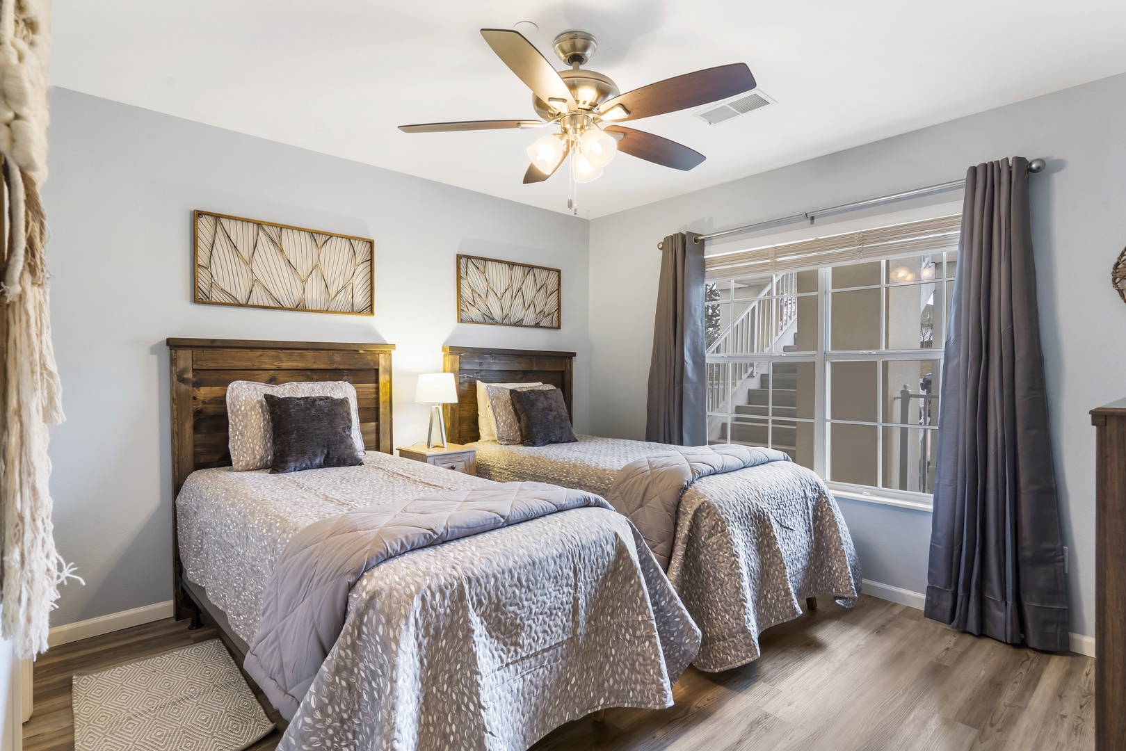 This cozy bedroom retreat offers a pair of twin beds, private ensuite, & TV