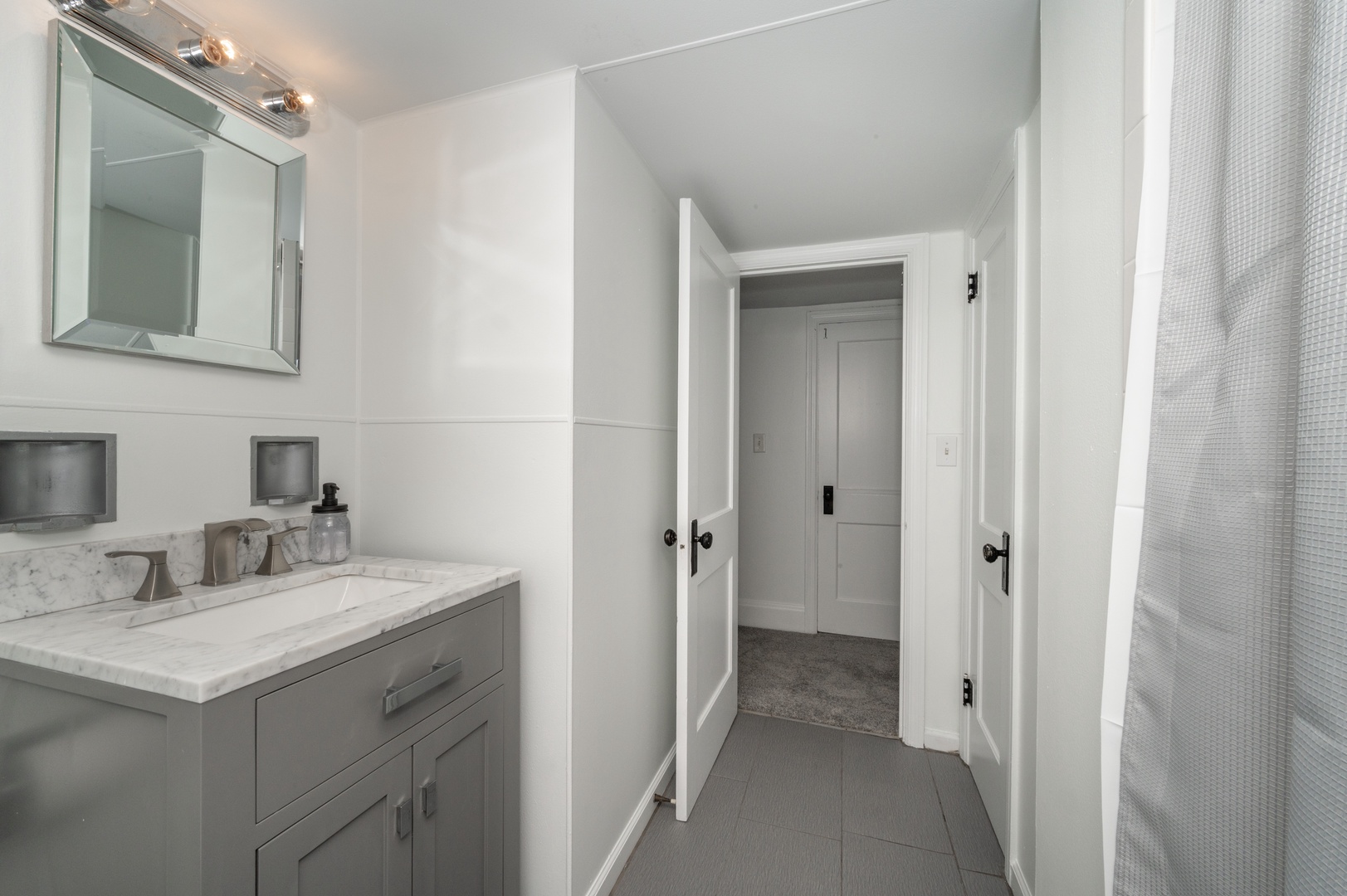 Unit 2 – A full bath on the 3rd level offers a single vanity & walk-in shower