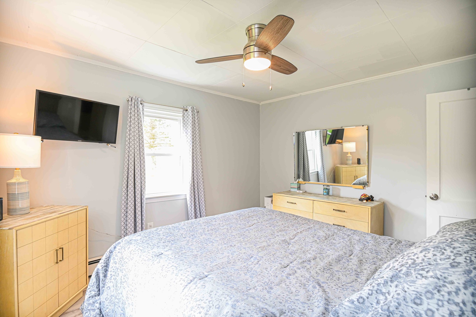 Bedroom 1 with queen bed and TV