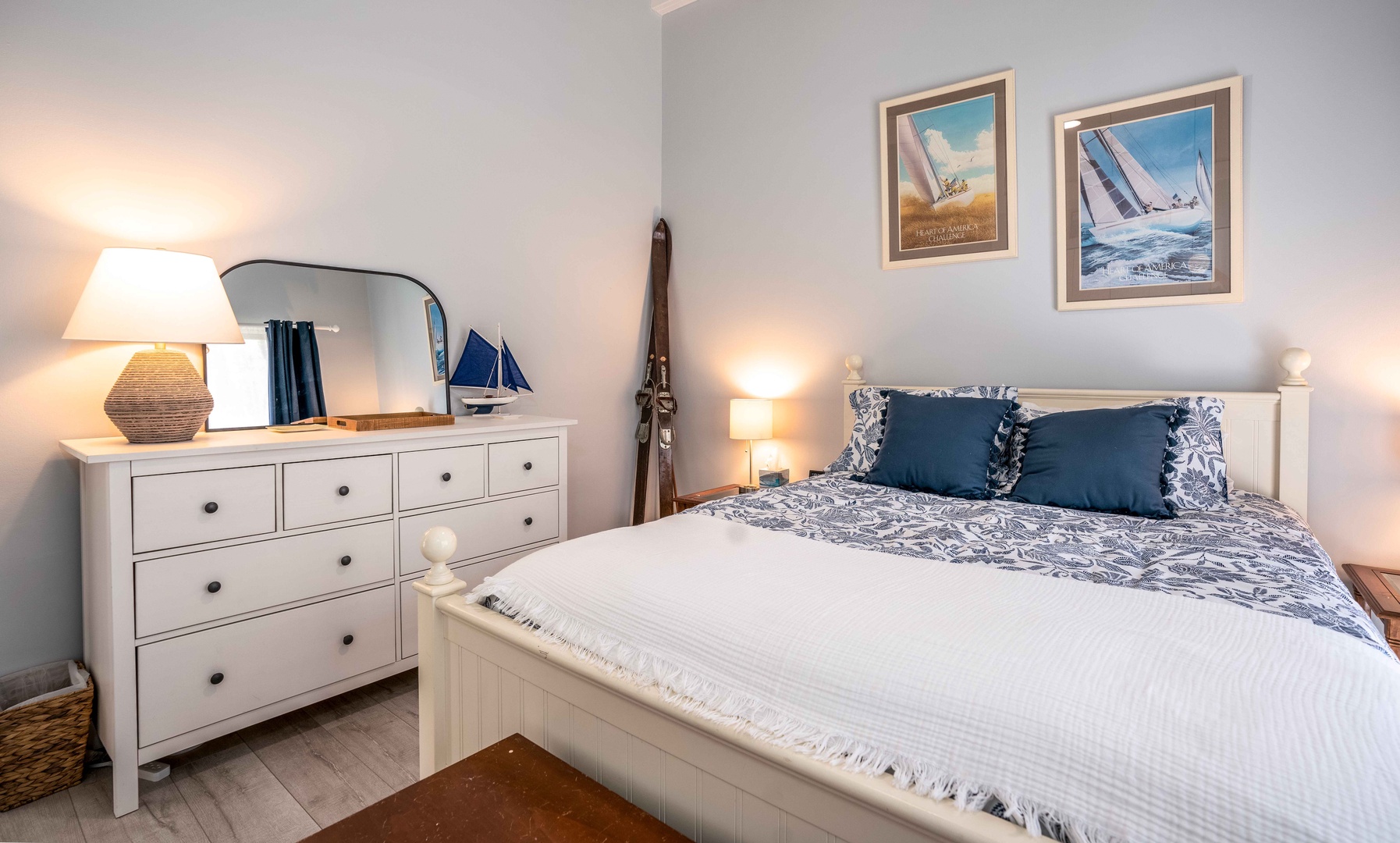 The primary bedroom sanctuary boasts a queen-sized bed & deck access