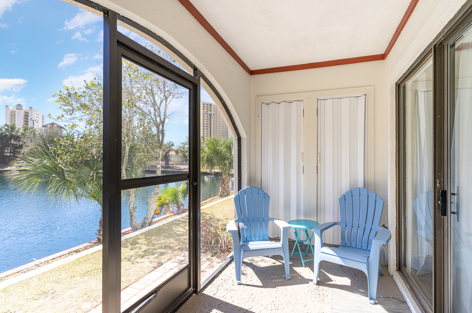 Lounge the day away with serene water views on the screened patio