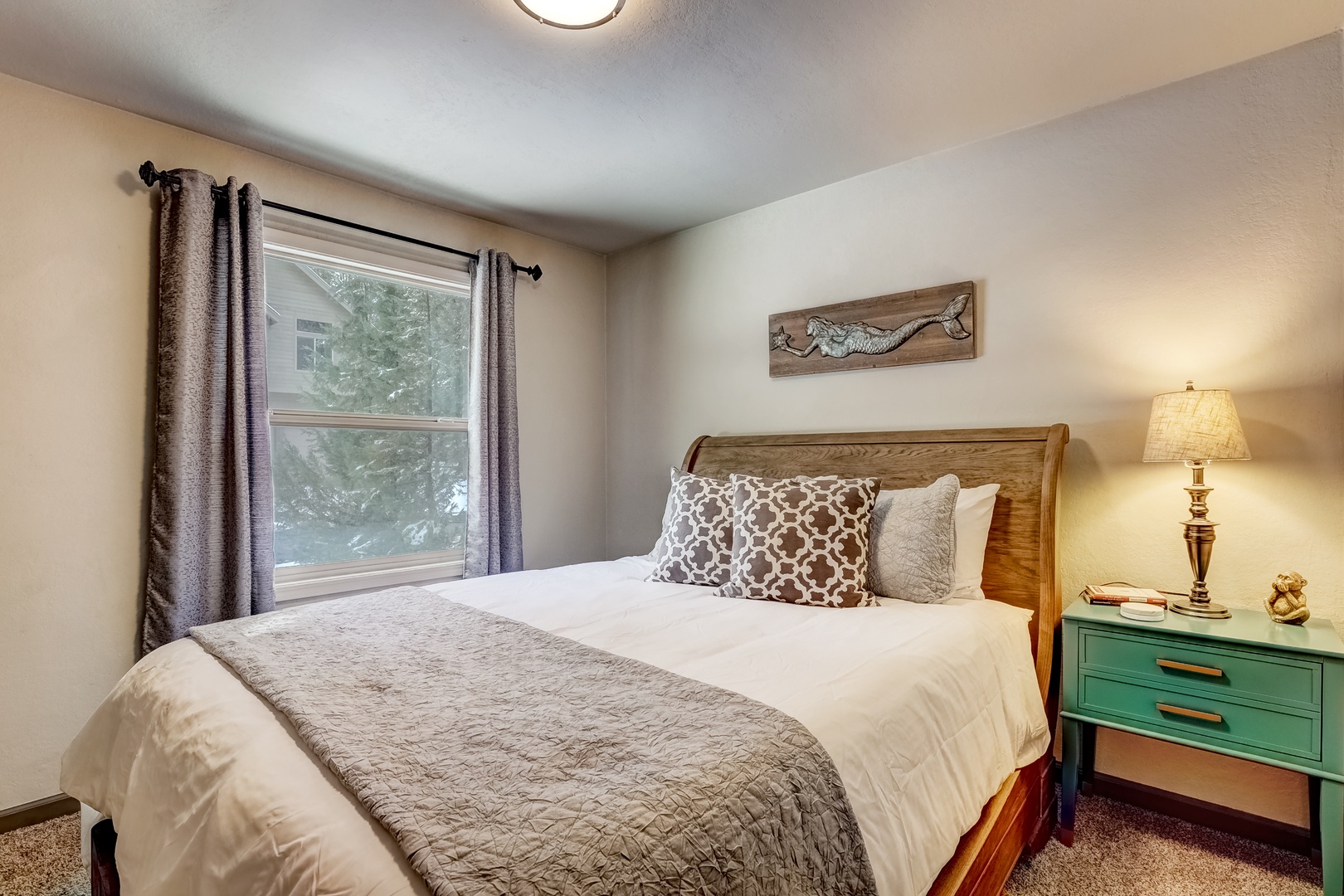 On the main level, the 1st of 2 bedrooms offers a comfortable queen bed