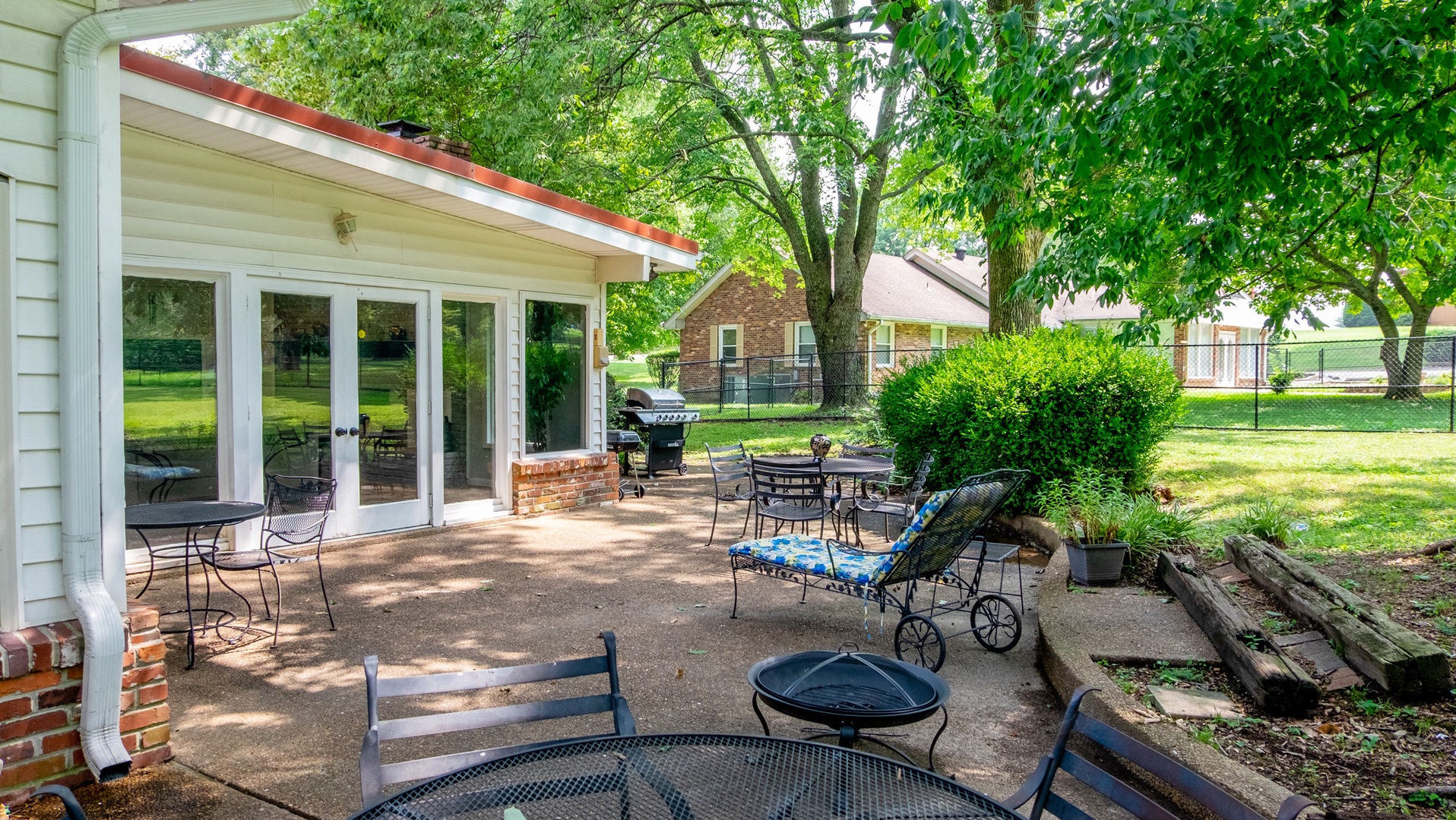 Expansive patio with seating on the acre land