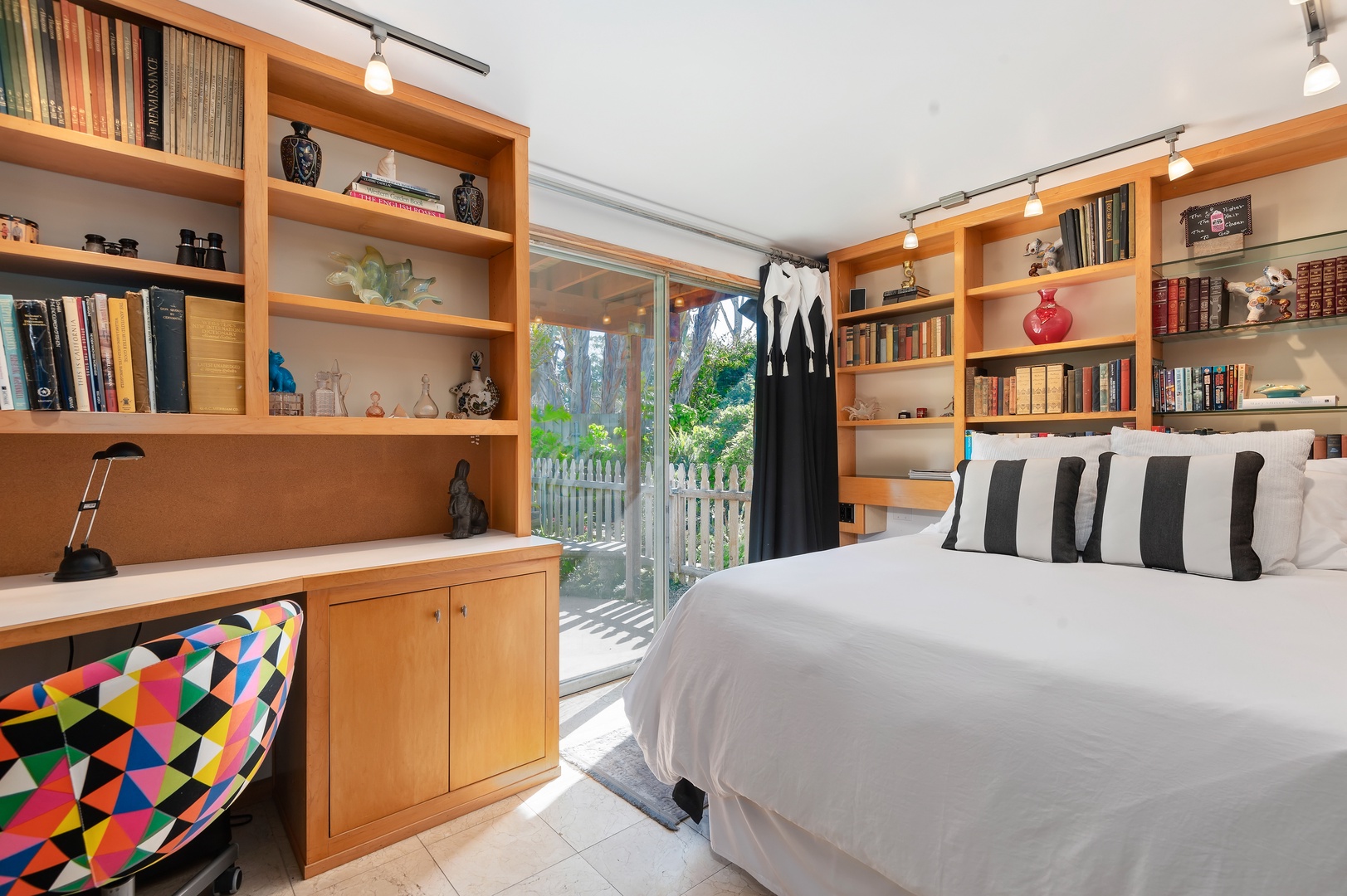 Working from home? Not a problem with this Library-Style First Floor Queen Bedroom with access to the Patio