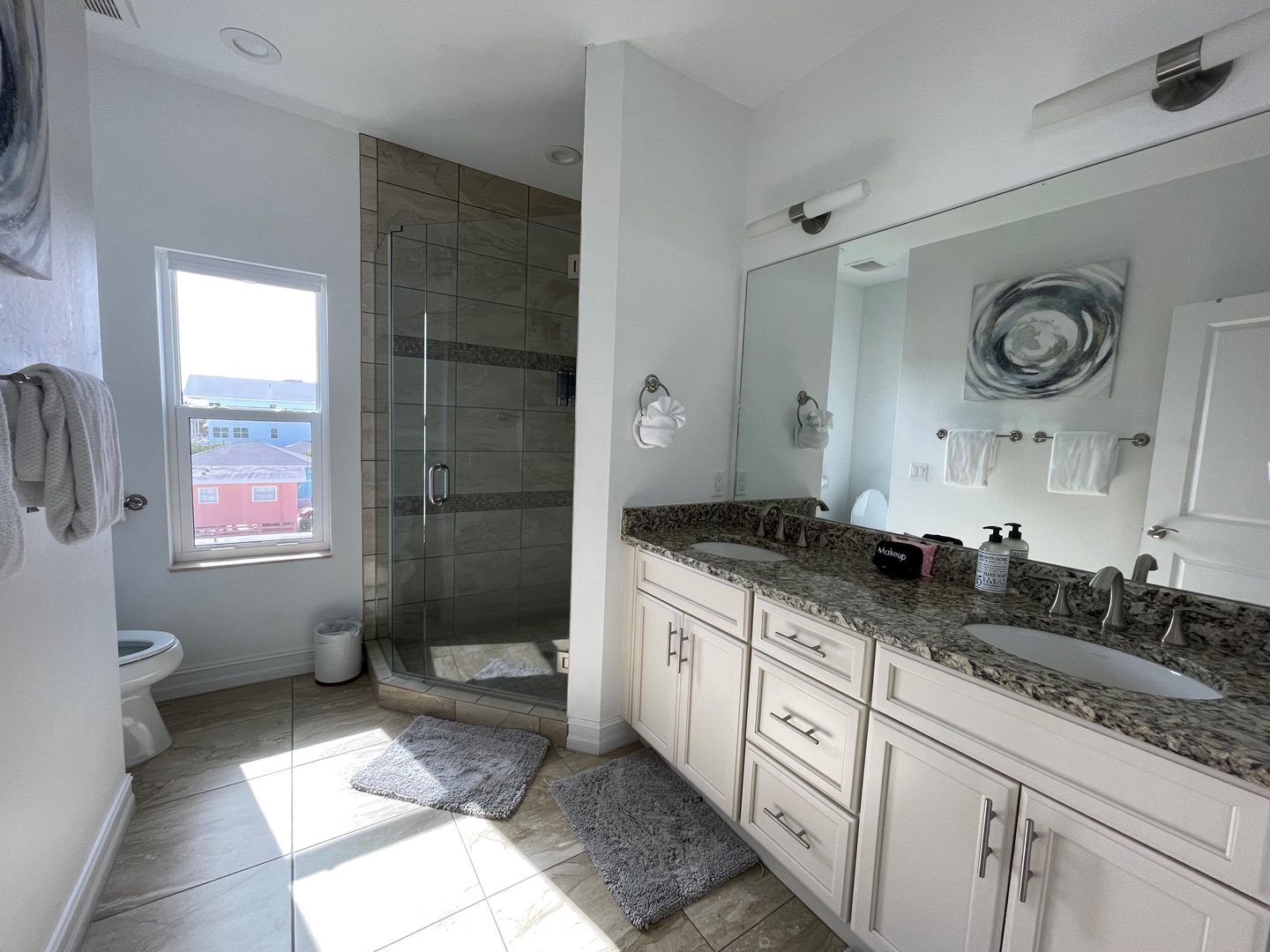 Master bedroom en suite with dual sinks, and walk in shower