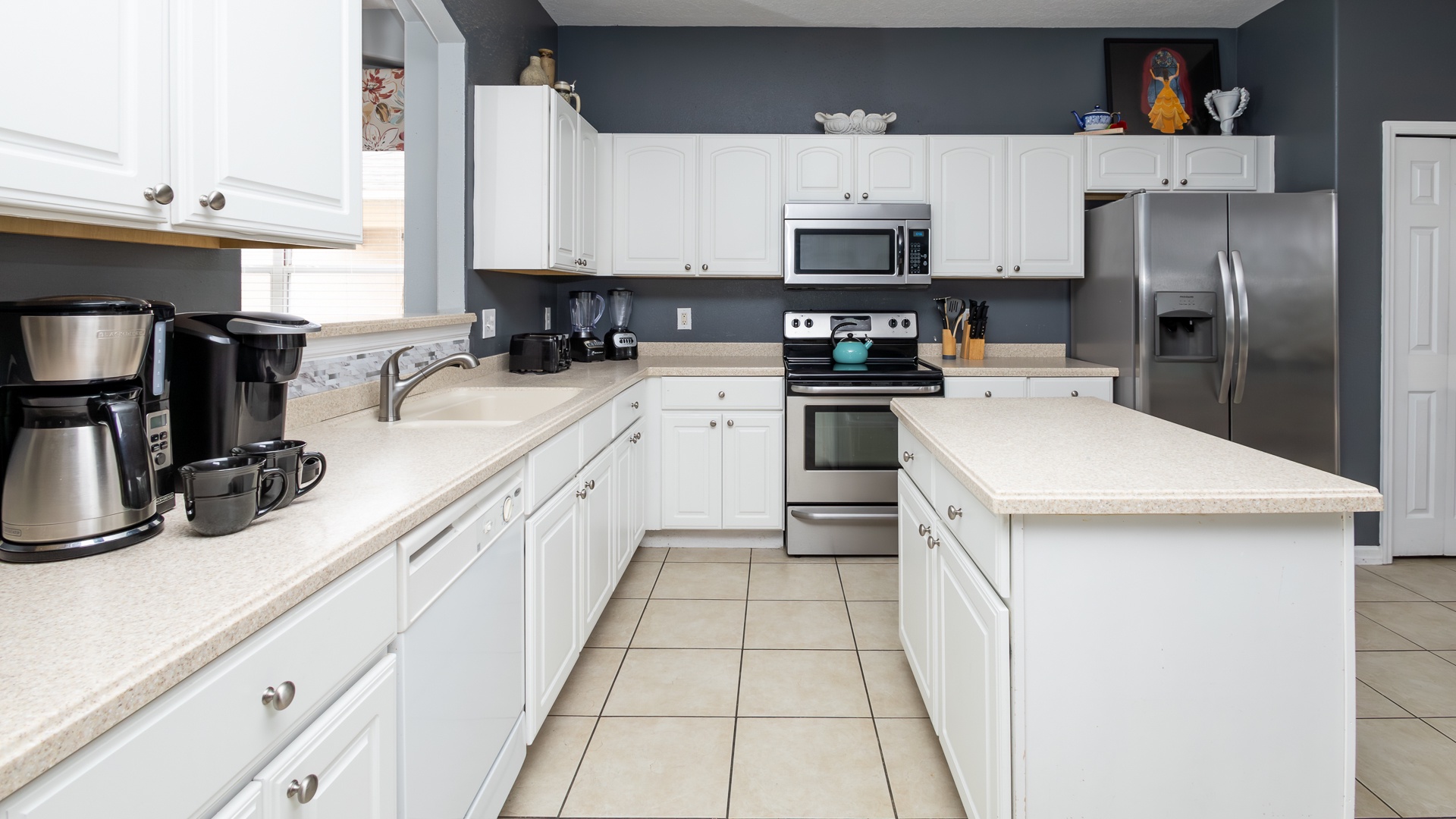 The open, airy kitchen offers ample space & all the comforts of home