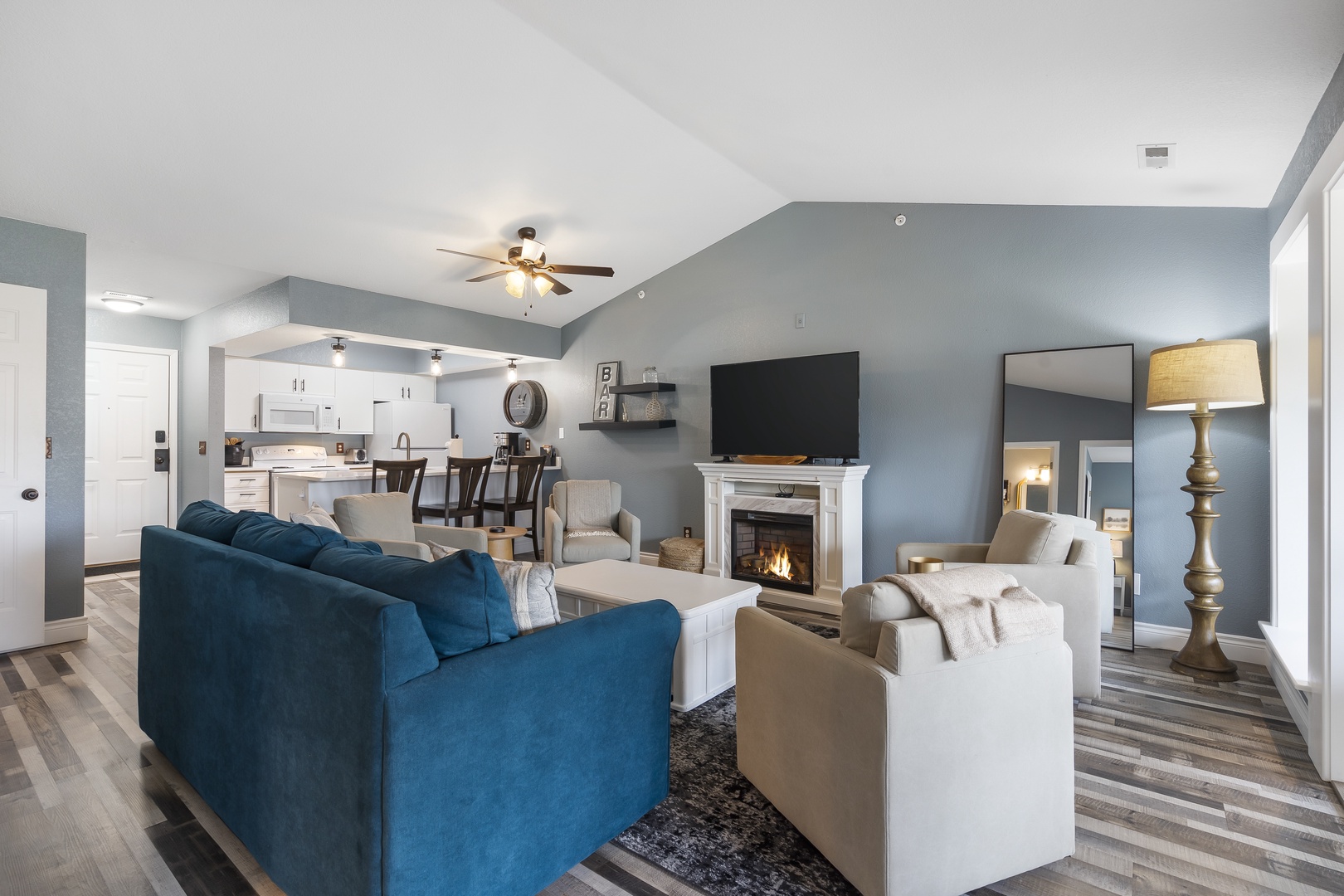 Curl up in the airy living room & enjoy a movie night by the electric fireplace