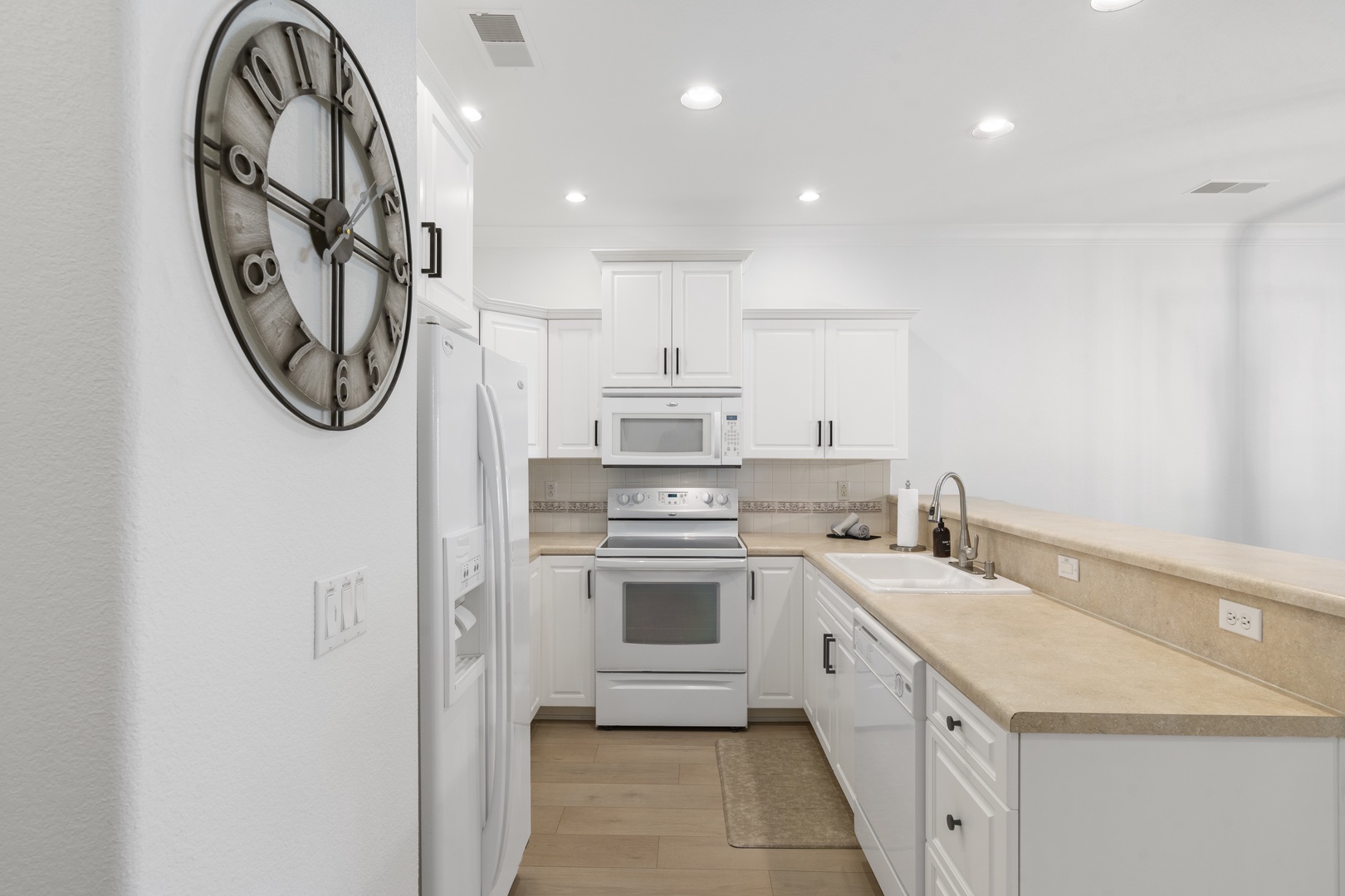 The fully equipped kitchen offers ample counter and storage space