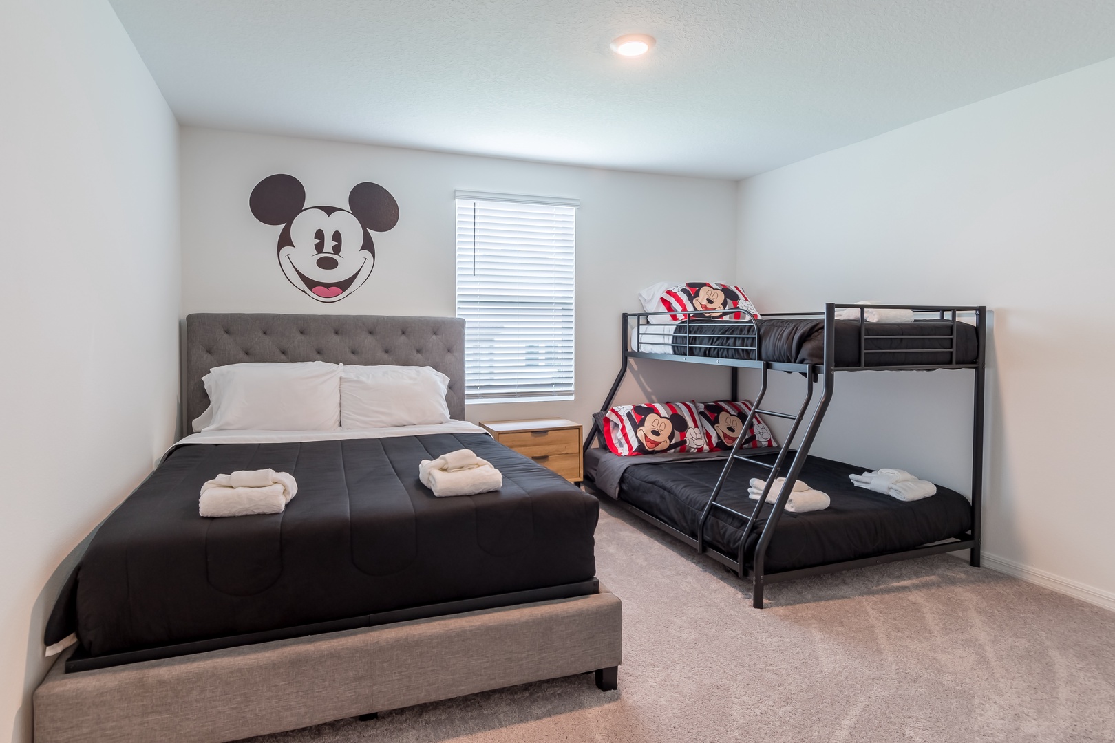 The kids bedroom offers an ensuite, twin-over-full bunkbed & queen bed