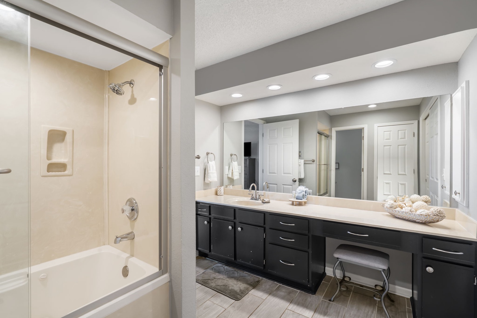 Unit 19: The primary ensuite offers a large vanity & shower/tub combo
