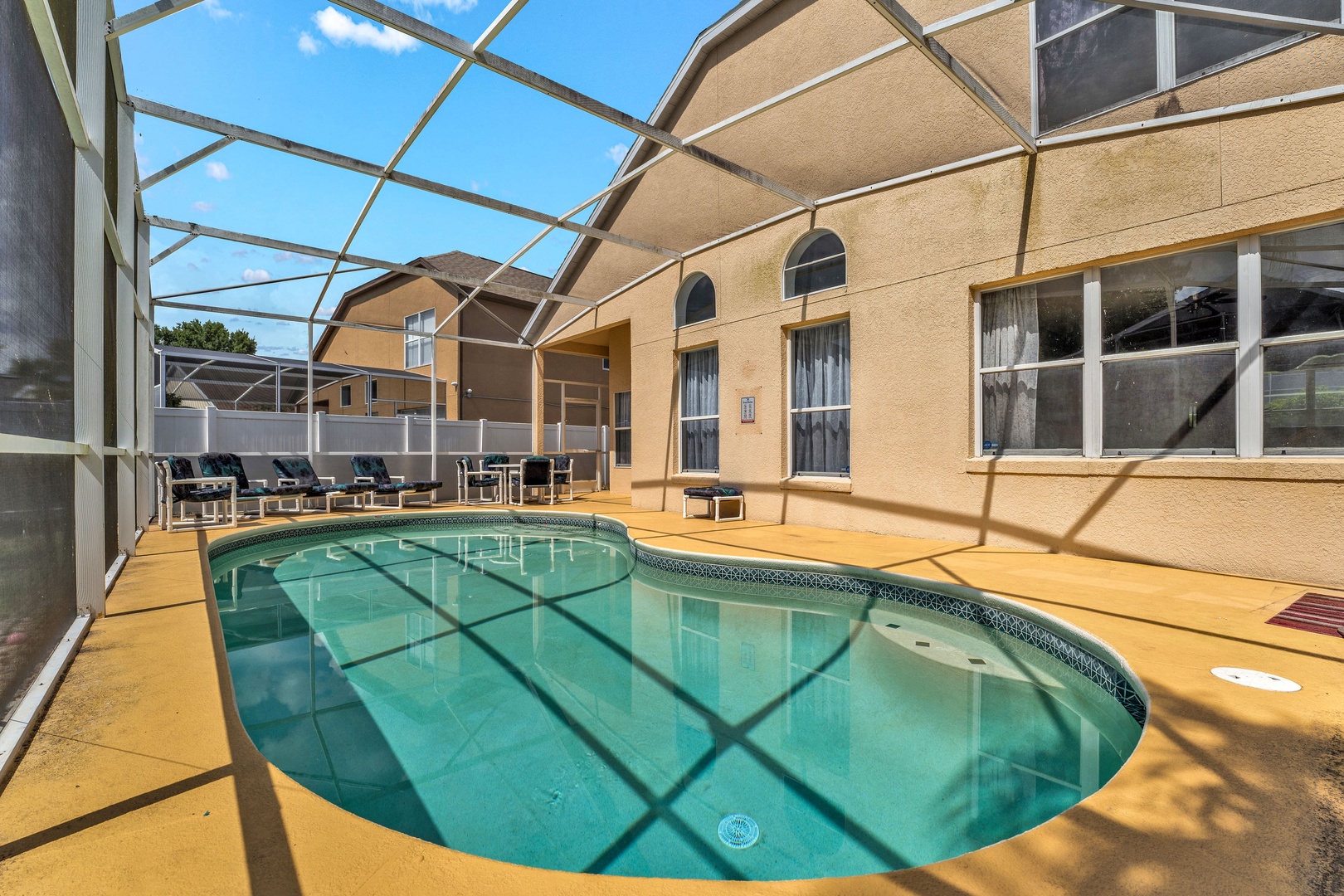 Private screened pool with outdoor seating