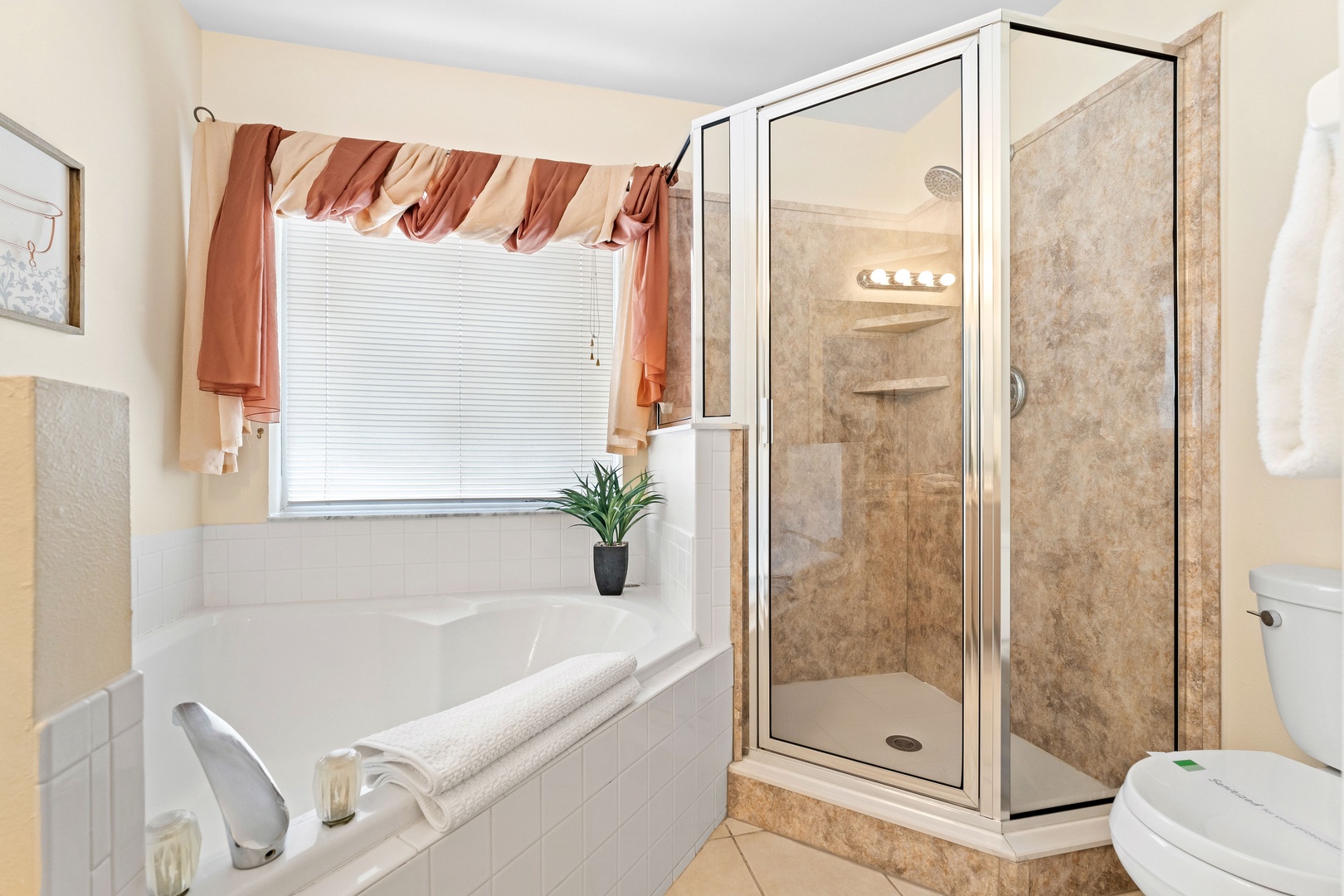 A double vanity soaking tub & walk-in shower is available in this ensuite bath