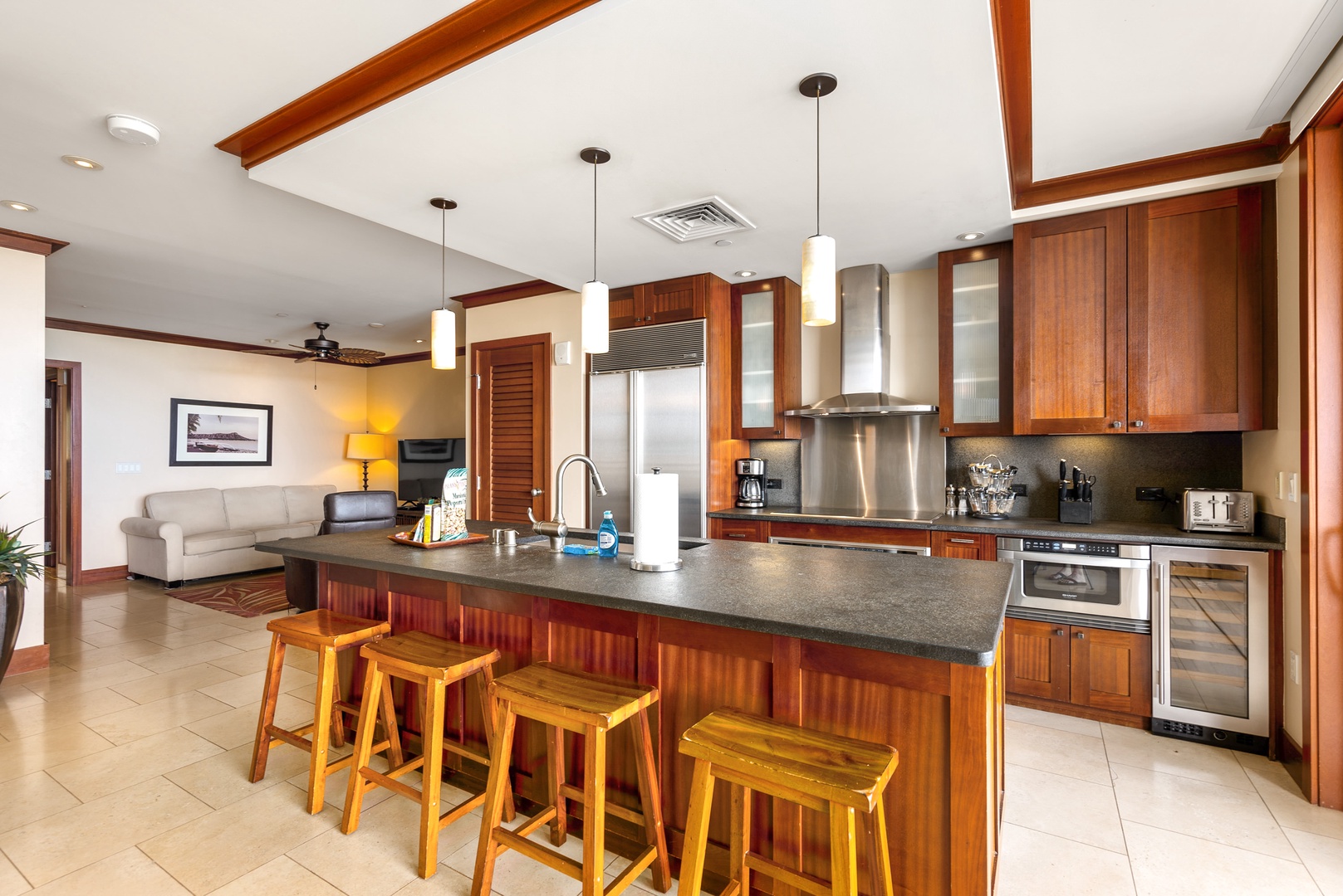 Kitchen with modern appliances and seating at the island counter