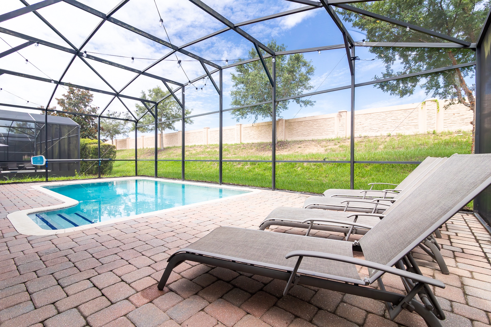 Lounge the day away or make a splash in the pool under the lanai