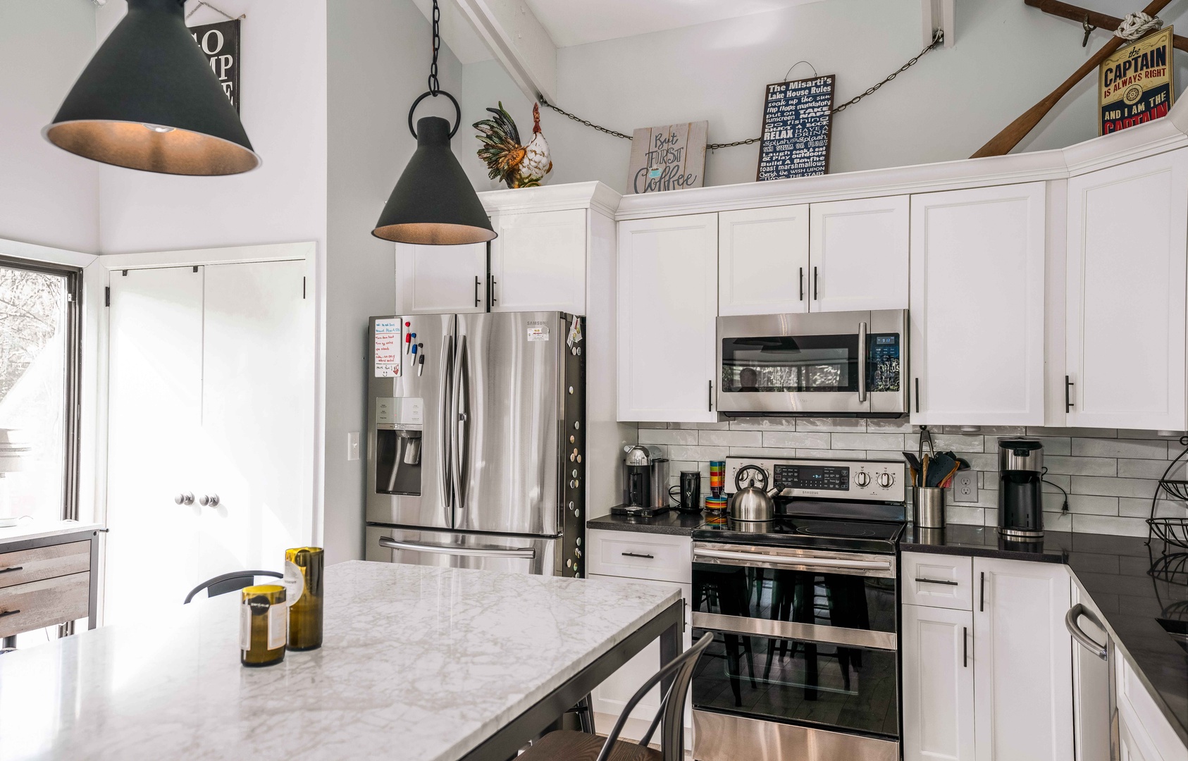 The open, airy kitchen offers ample space & all the comforts of home