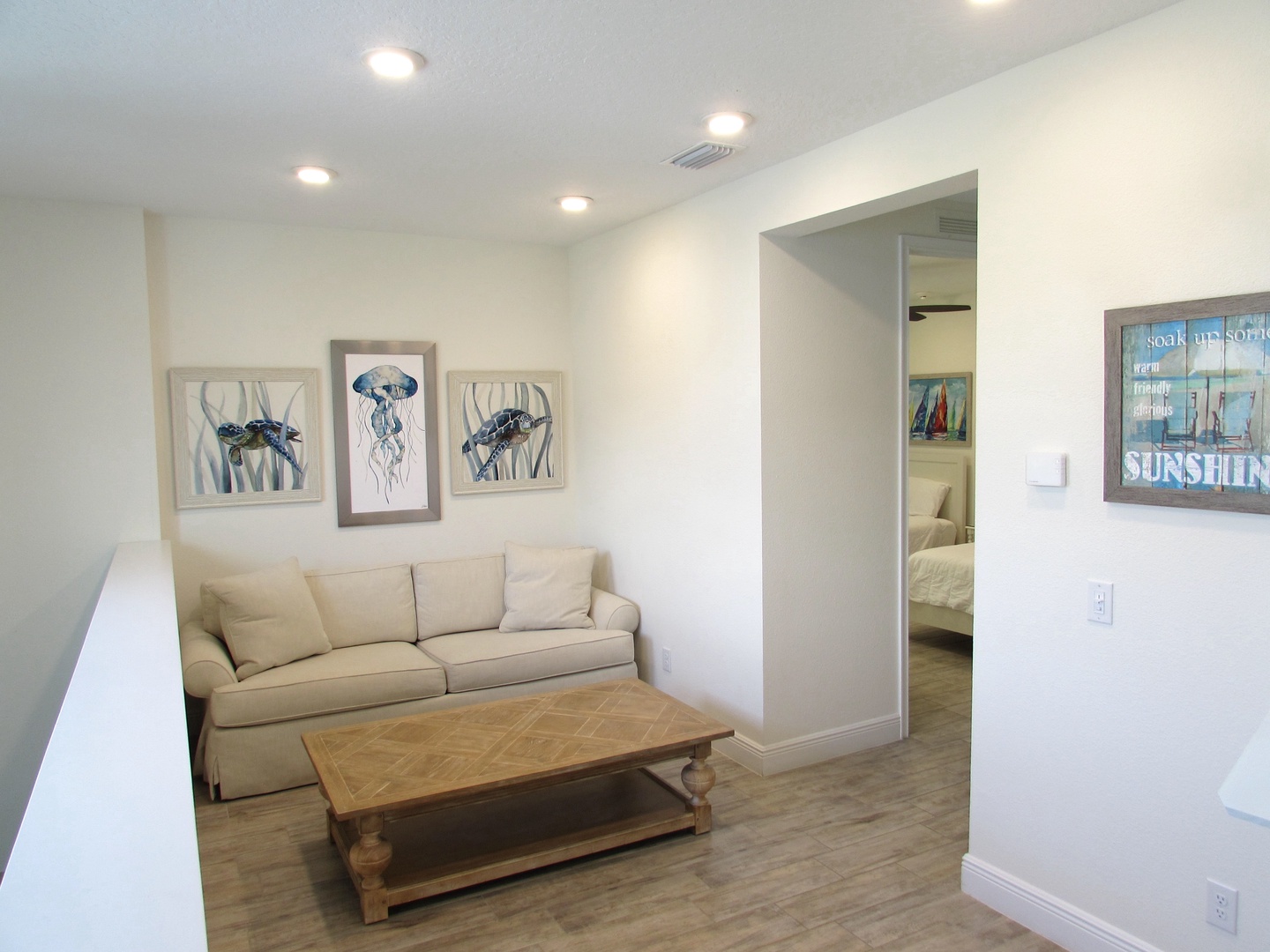 The 2nd floor loft features a sleeper sofa and oceanic decor