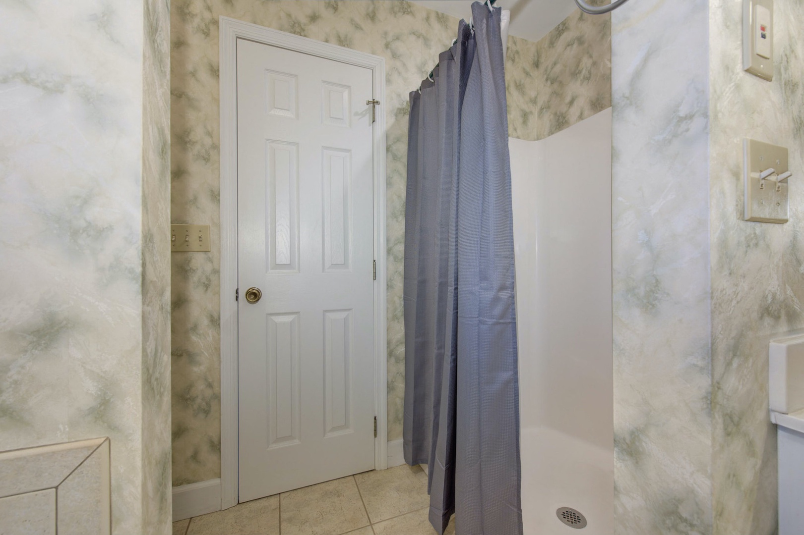 The king ensuite boasts a large vanity, walk-in shower, & jetted tub