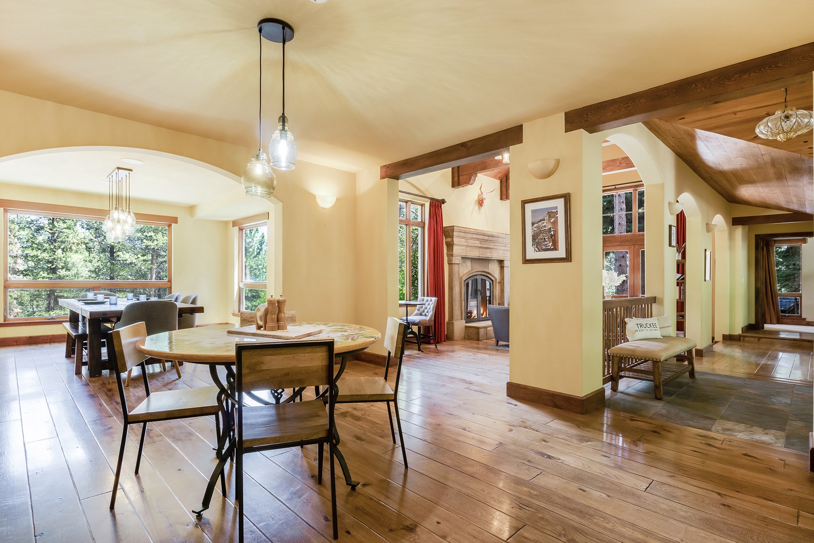 Dining area with multiple tables with seating, and paint station