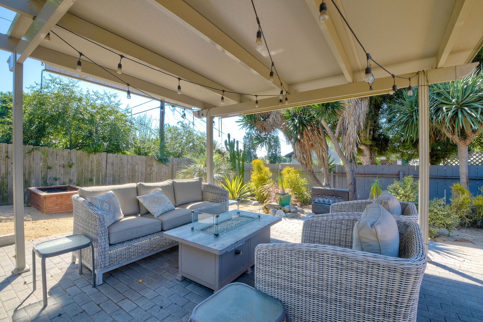 Head outside to the back yard & relax in the shade under the pergola